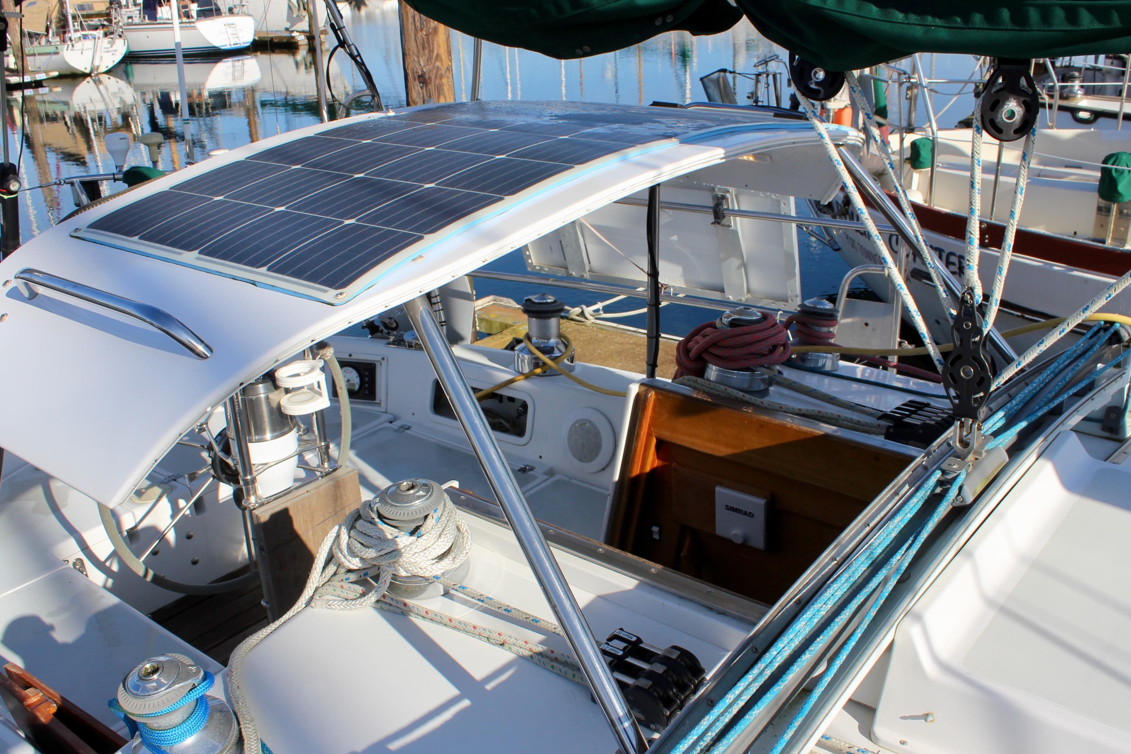 1997 Valiant 39 sailboat cockpit with solar panel and rigging details.