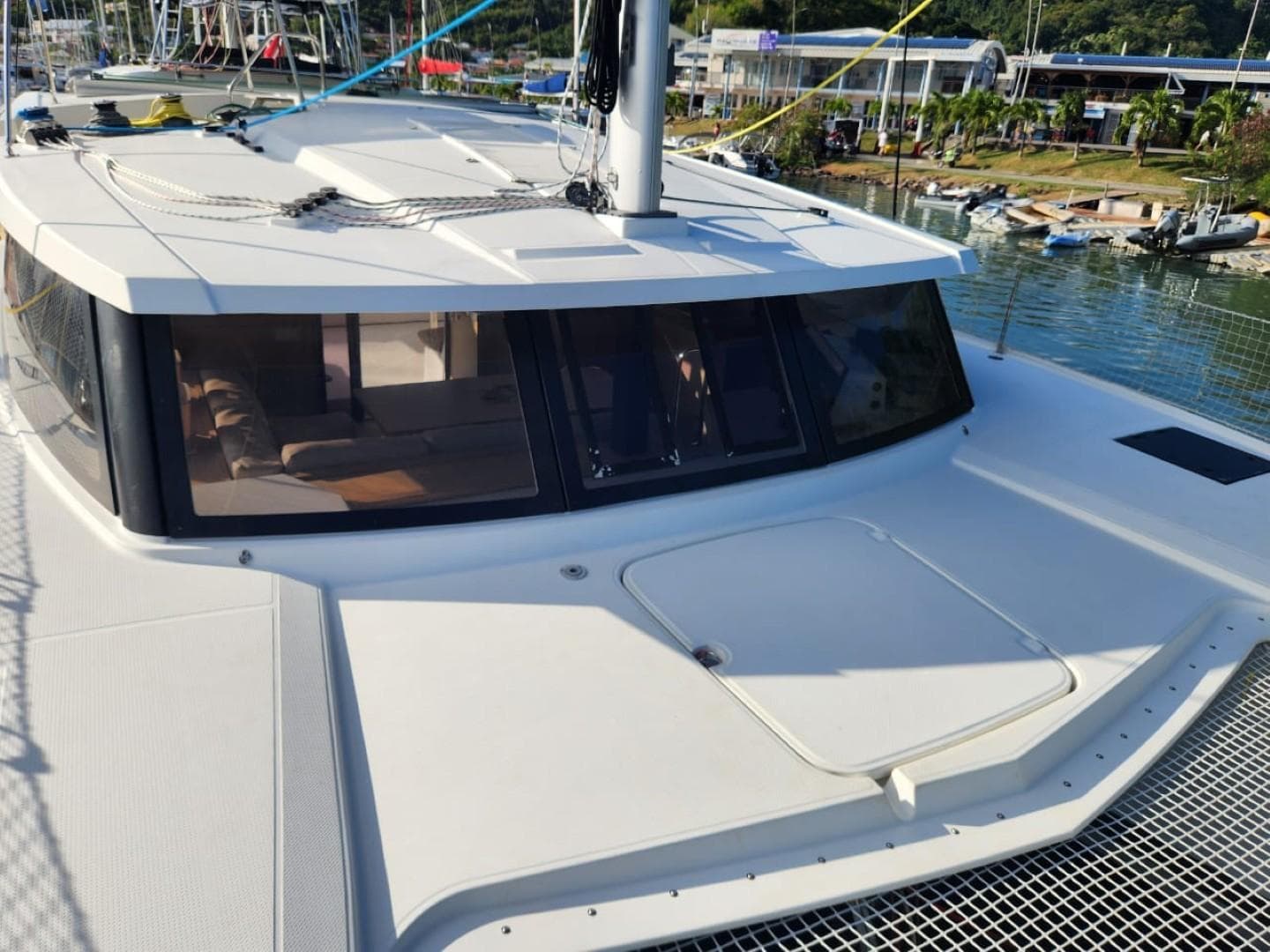 2017 Fountaine Pajot Lucia 40 catamaran docked, showcasing sleek design and spacious deck.