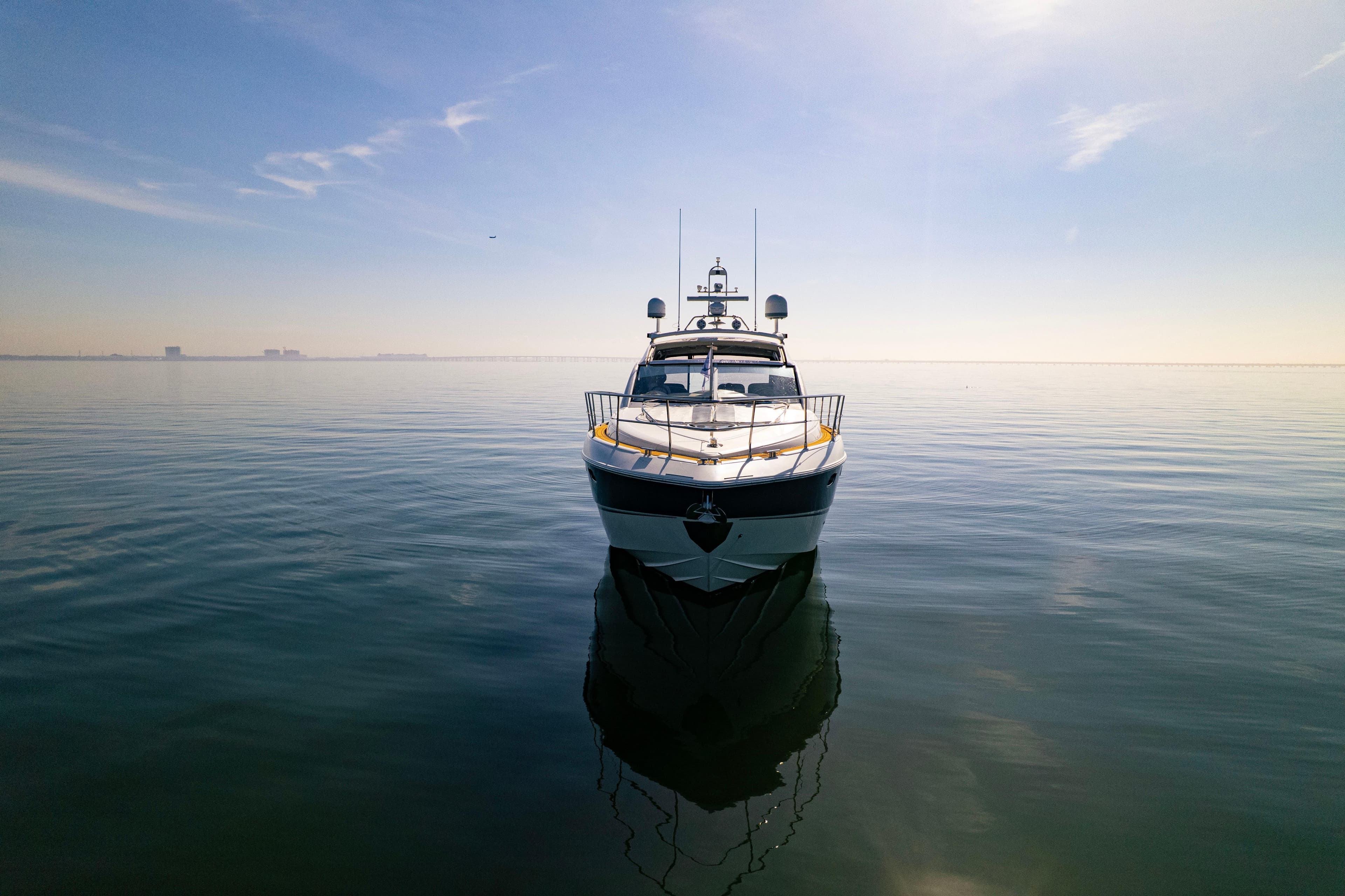 2009 Fairline Targa 52 yacht on calm sea under clear sky.
