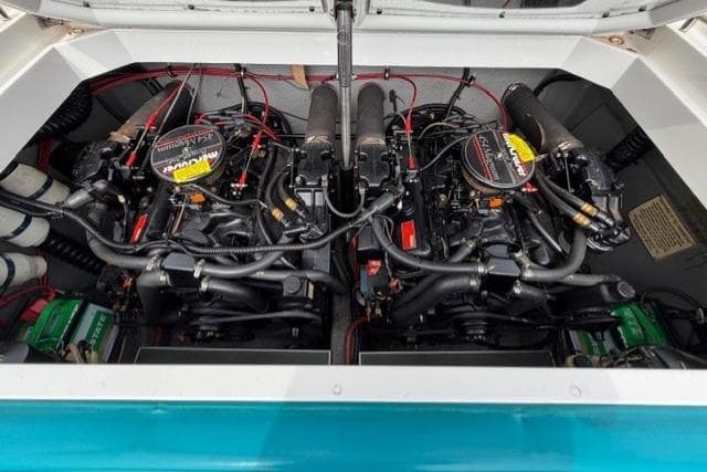 Twin engines in a 1989 Formula 292 SR-1 boat, detailed view.