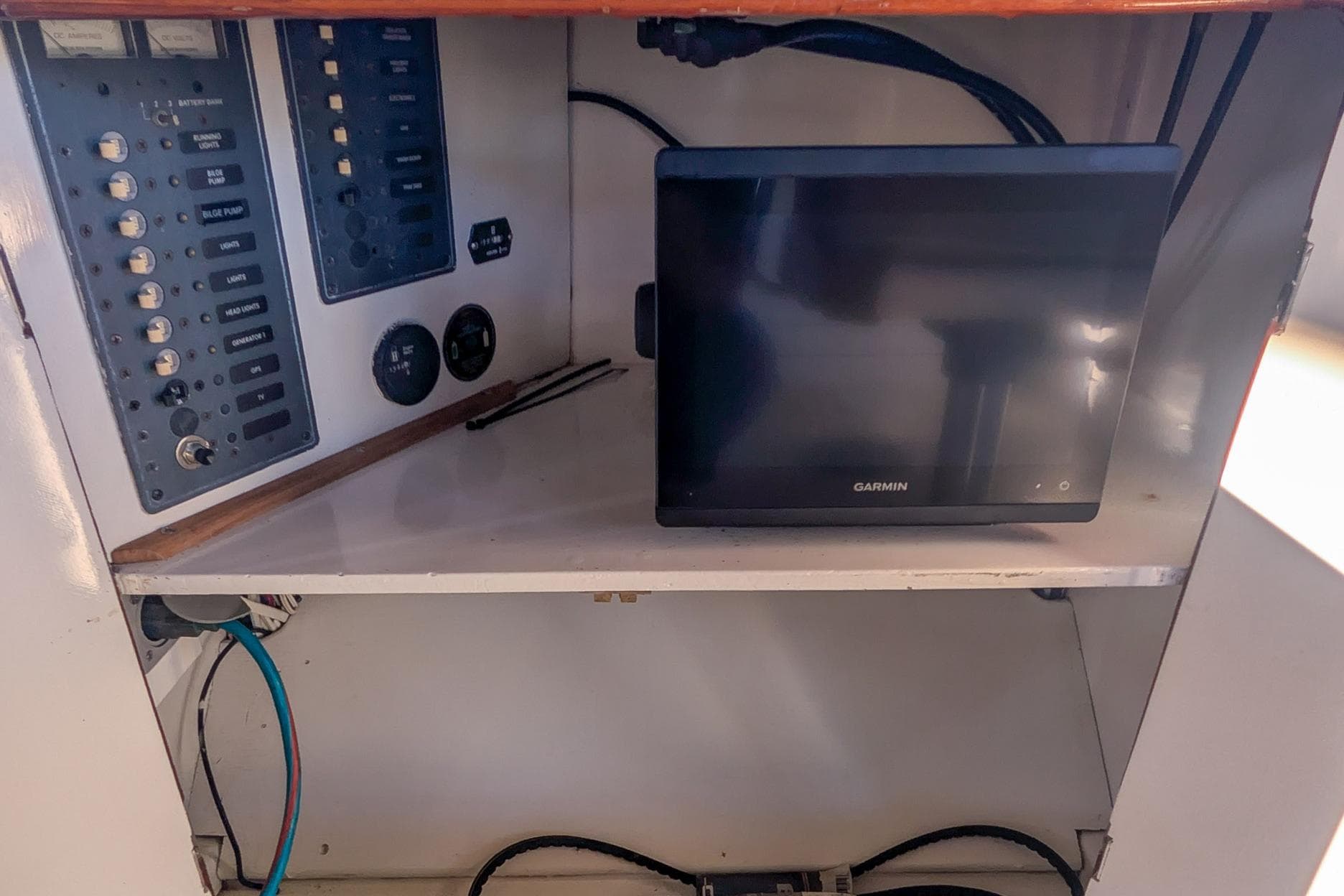 Control panel and Garmin device inside a 1954 Daniels Brothers model 28 boat.