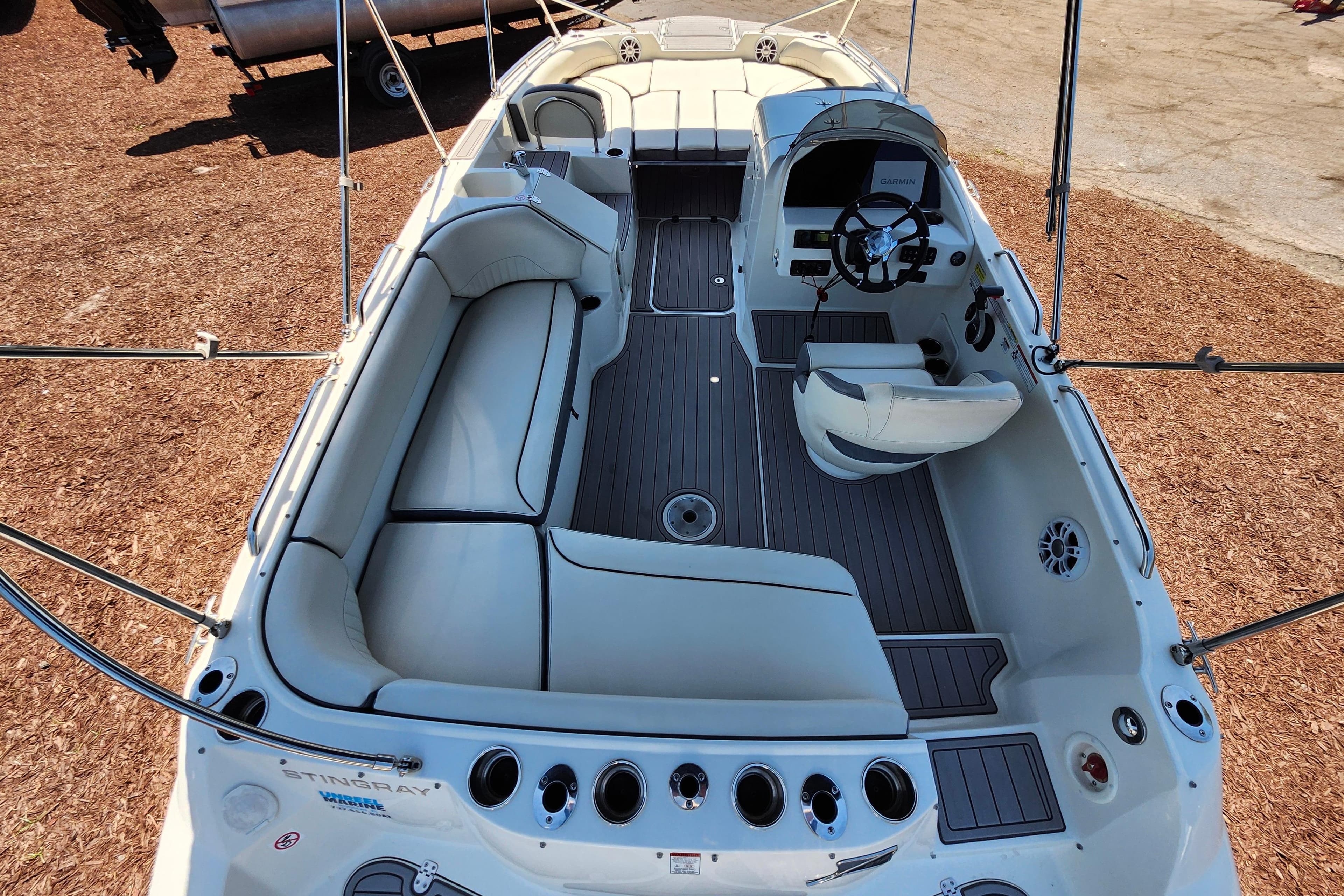 2024 Stingray 212 SC boat interior with spacious seating and modern helm.