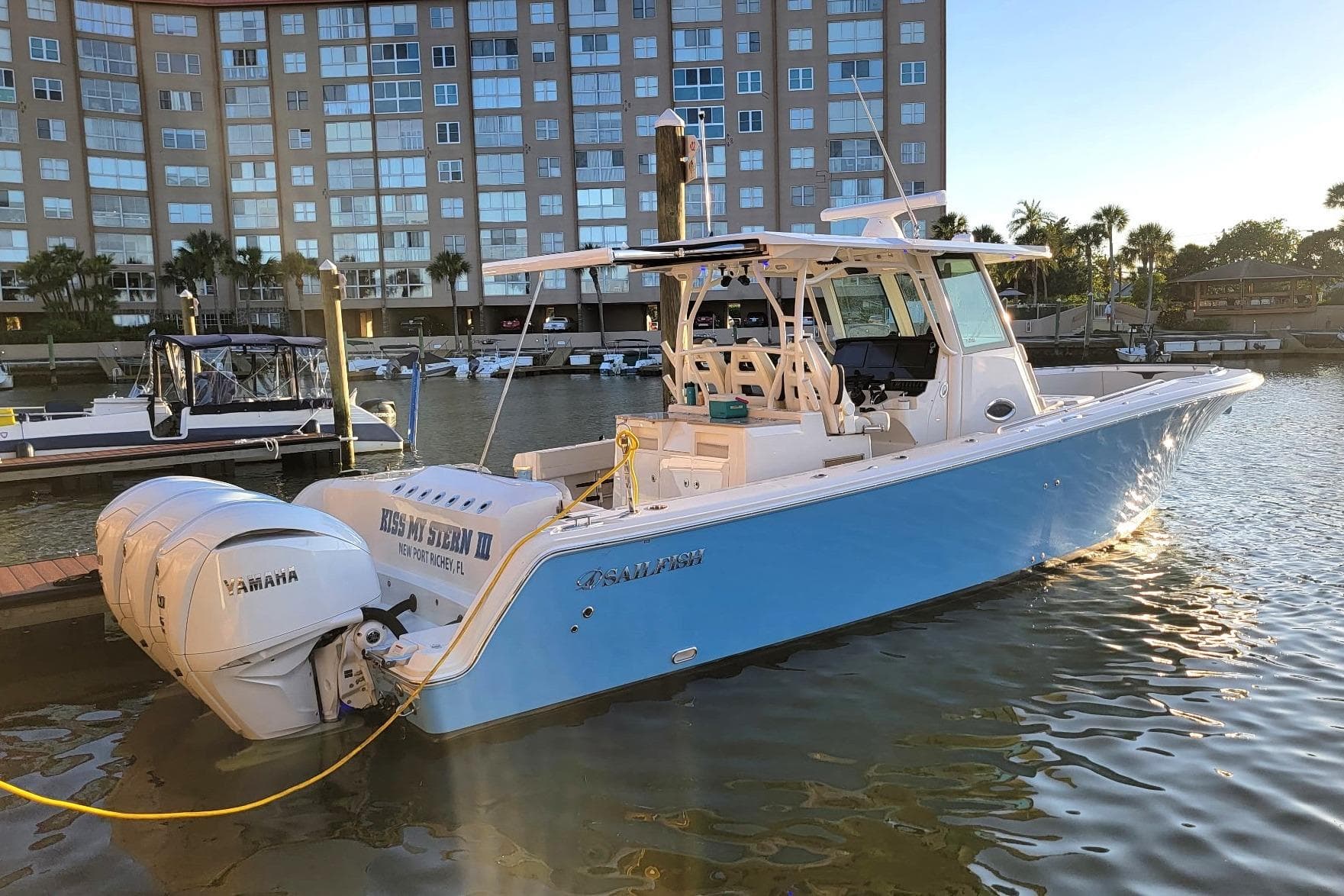 2022 Sailfish 360 CC boat docked in marina with Yamaha engines.