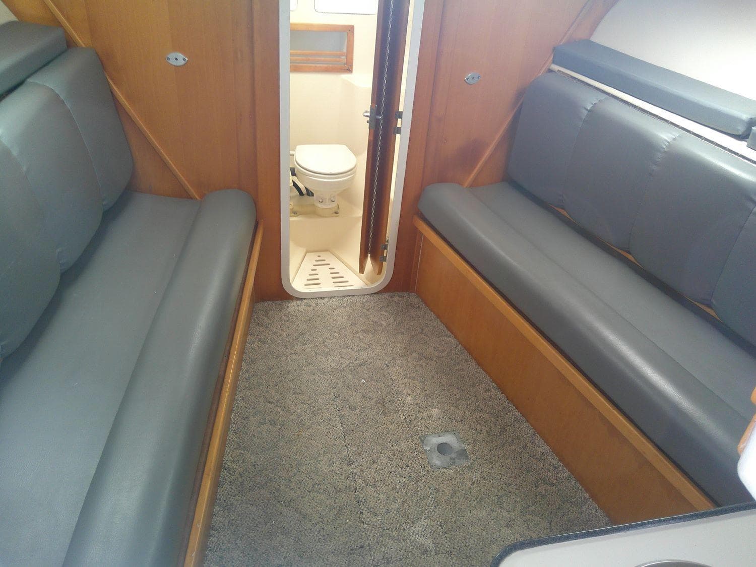 Interior of 2000 Luhrs Tournament 290 Open boat with seating and bathroom.