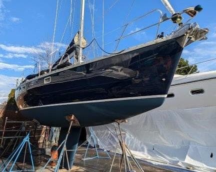 1990 Jeanneau Sun Magic 44 sailboat elevated for maintenance.