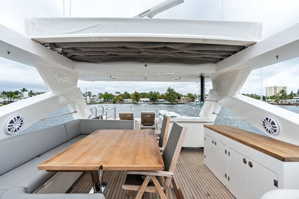 Luxurious 2012 Sunseeker 88 Yacht deck with elegant seating and dining area.