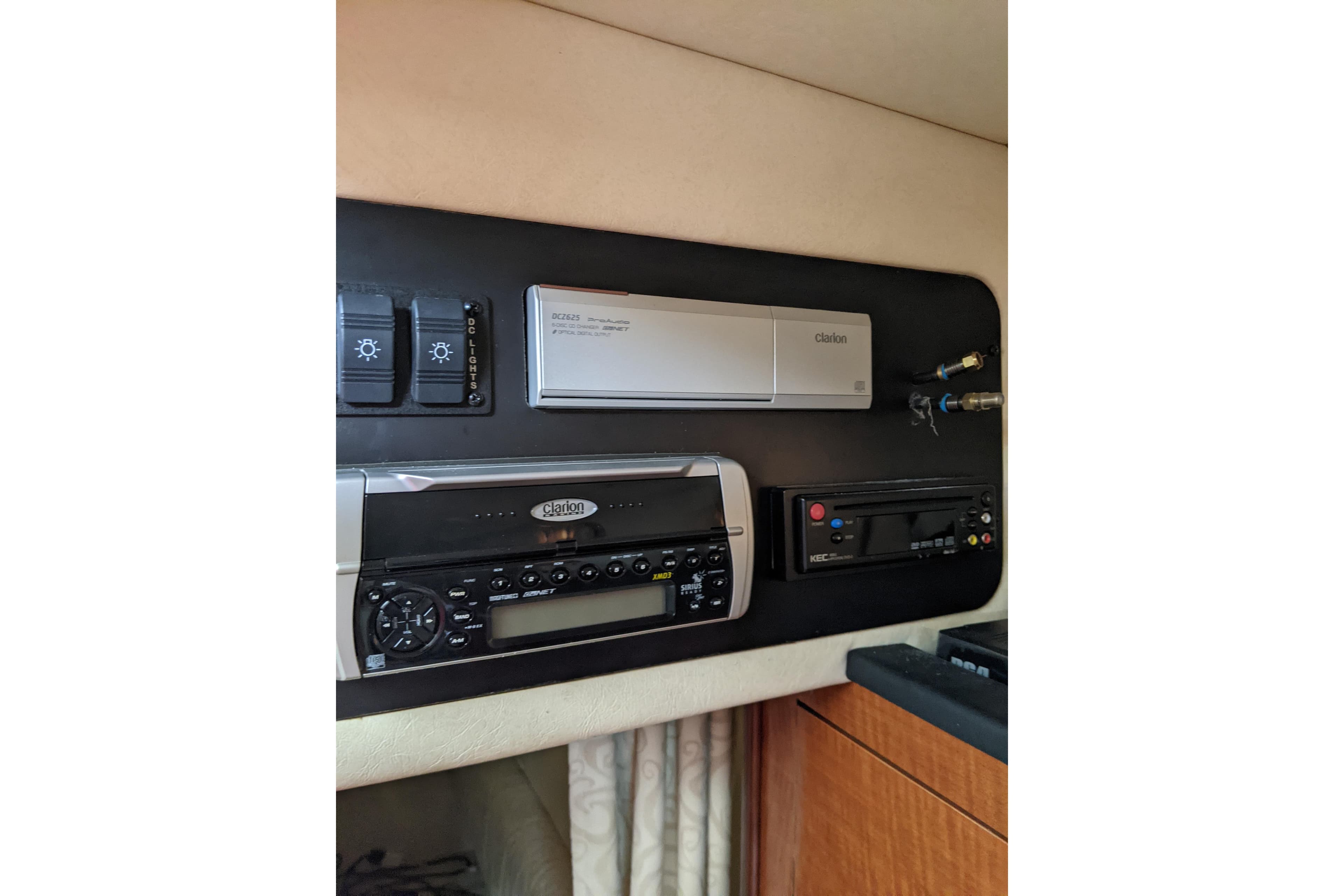 2005 Sea Ray Sundancer 260 cabin electronics panel with Clarion audio system.