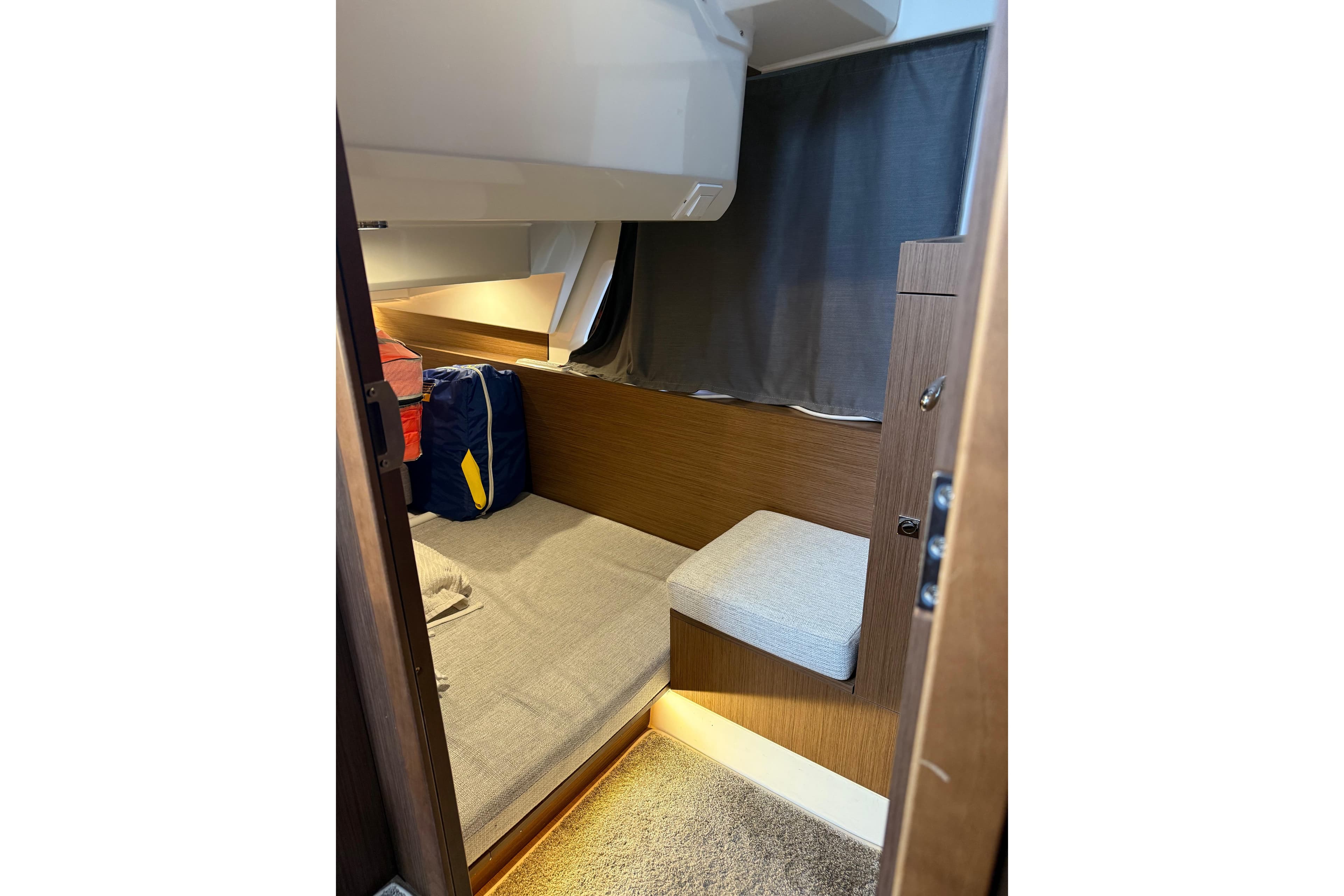 2022 Jeanneau NC Weekender 1095 cabin interior with cozy seating and modern design.