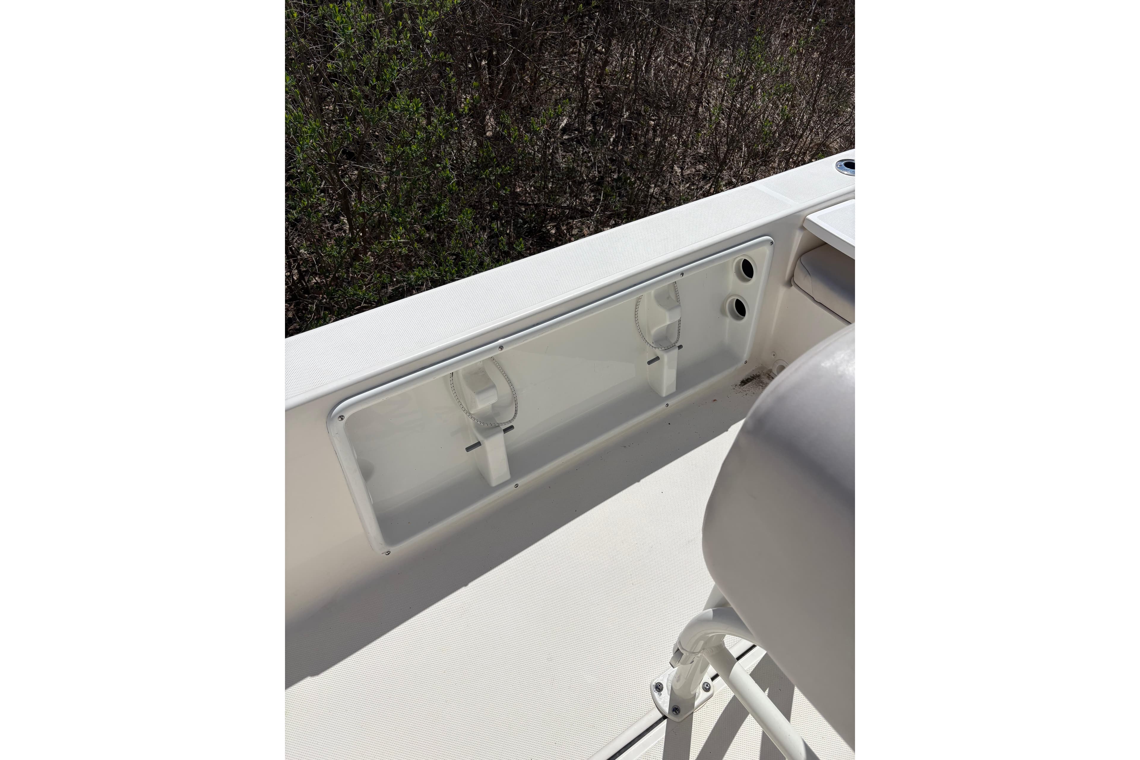 2021 Sea Born FX21 Bay boat interior detail with storage compartment and seating.