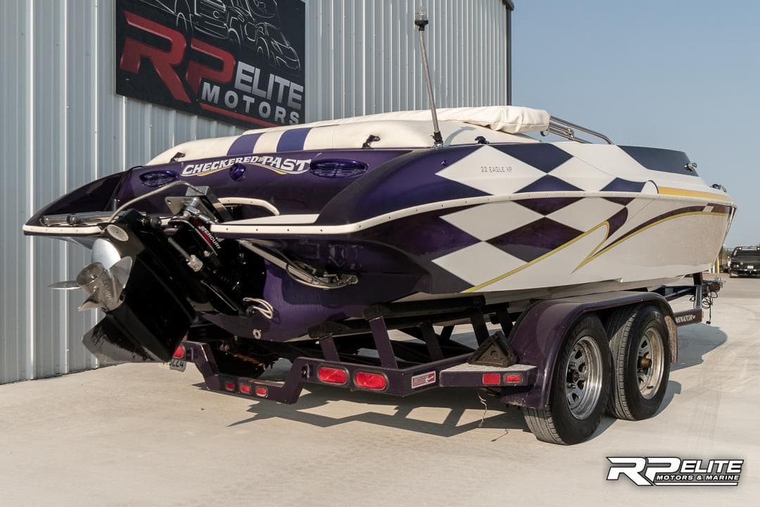 2000 Eliminator 220 Eagle XP boat with custom graphics on trailer at RP Elite Motors.
