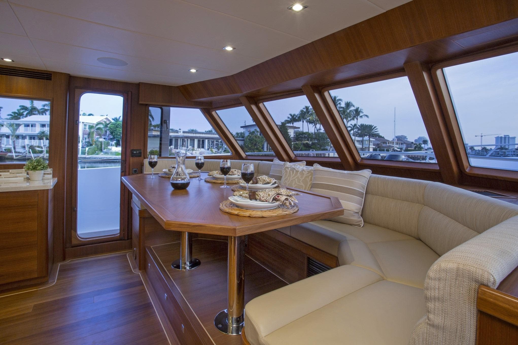 Luxurious interior of 2027 Outer Reef Yachts 860 Deluxbridge Motoryacht with elegant dining area.