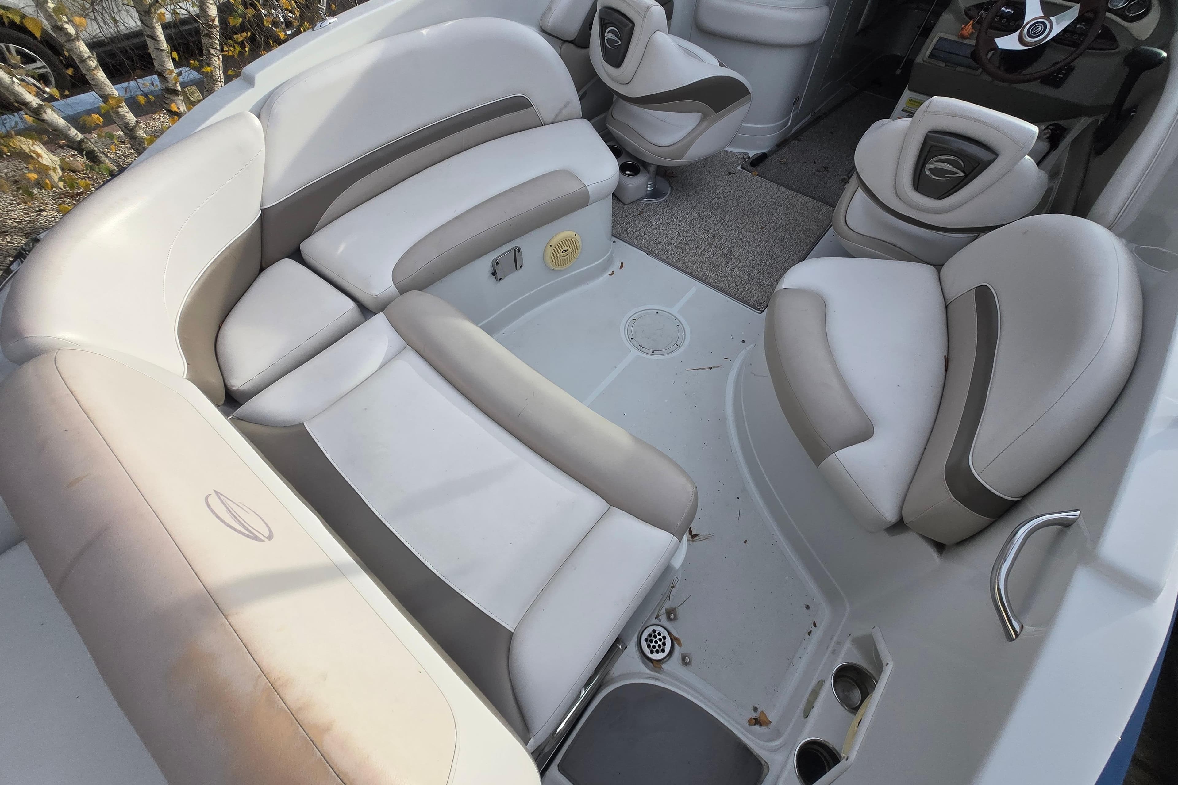 2012 Crownline Eclipse E4 boat interior with beige and gray seating arrangement.