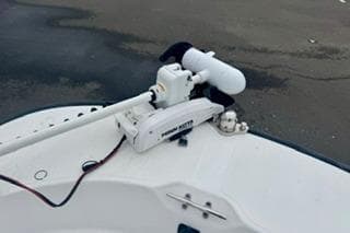 2014 Boston Whaler Montalk boat with mounted trolling motor on deck.