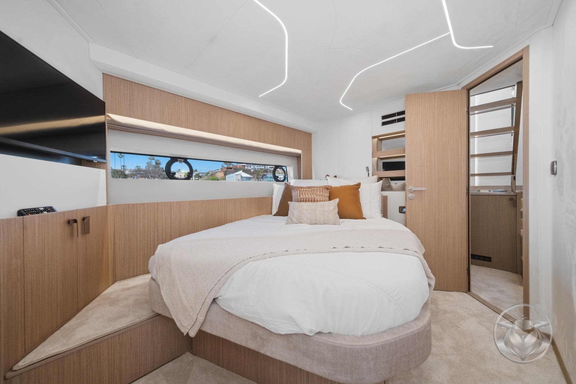Luxurious bedroom interior of 2026 Prestige F5.7 yacht with modern design and cozy bedding.