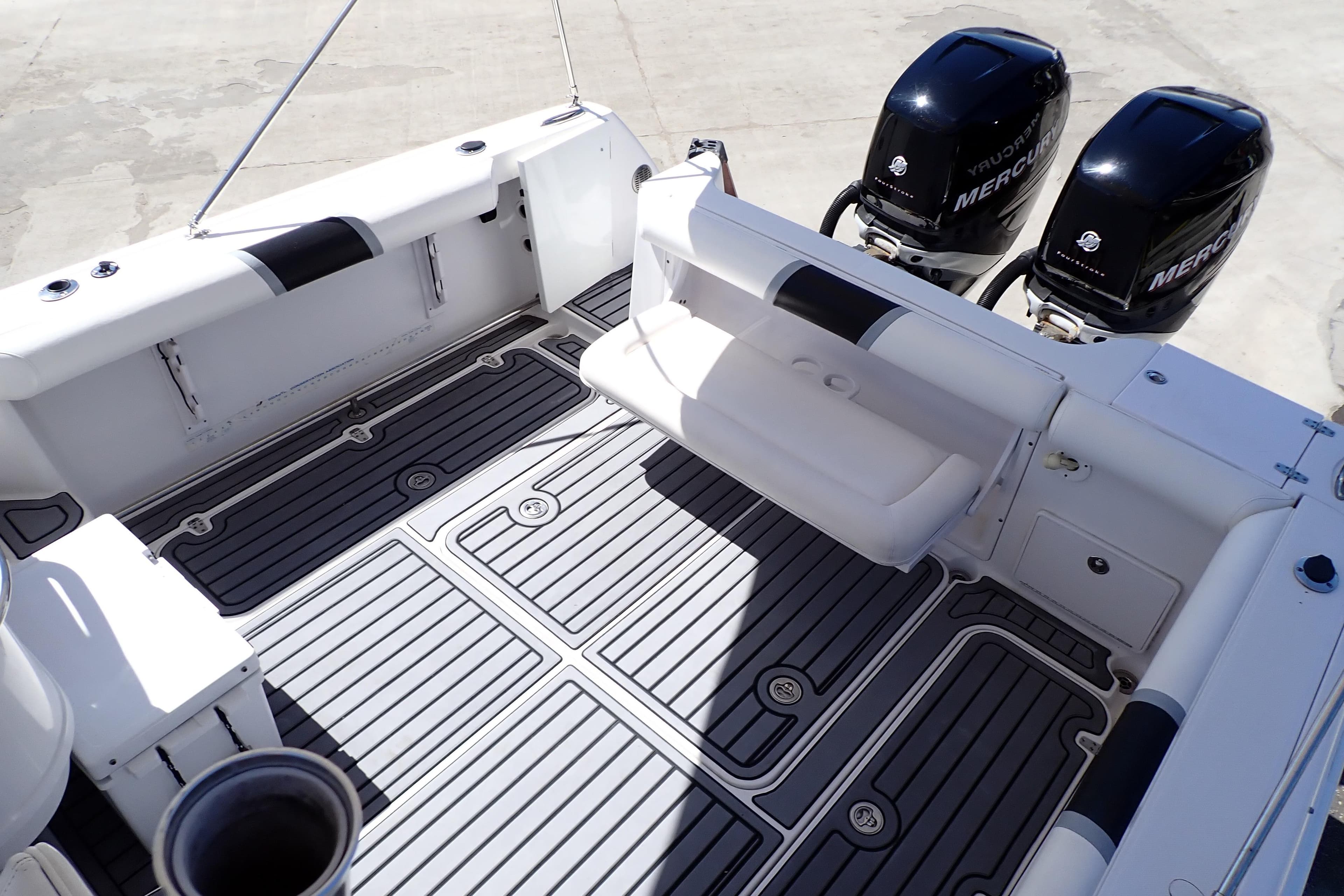 2014 Pro-Line 32 Express boat deck with twin Mercury engines.