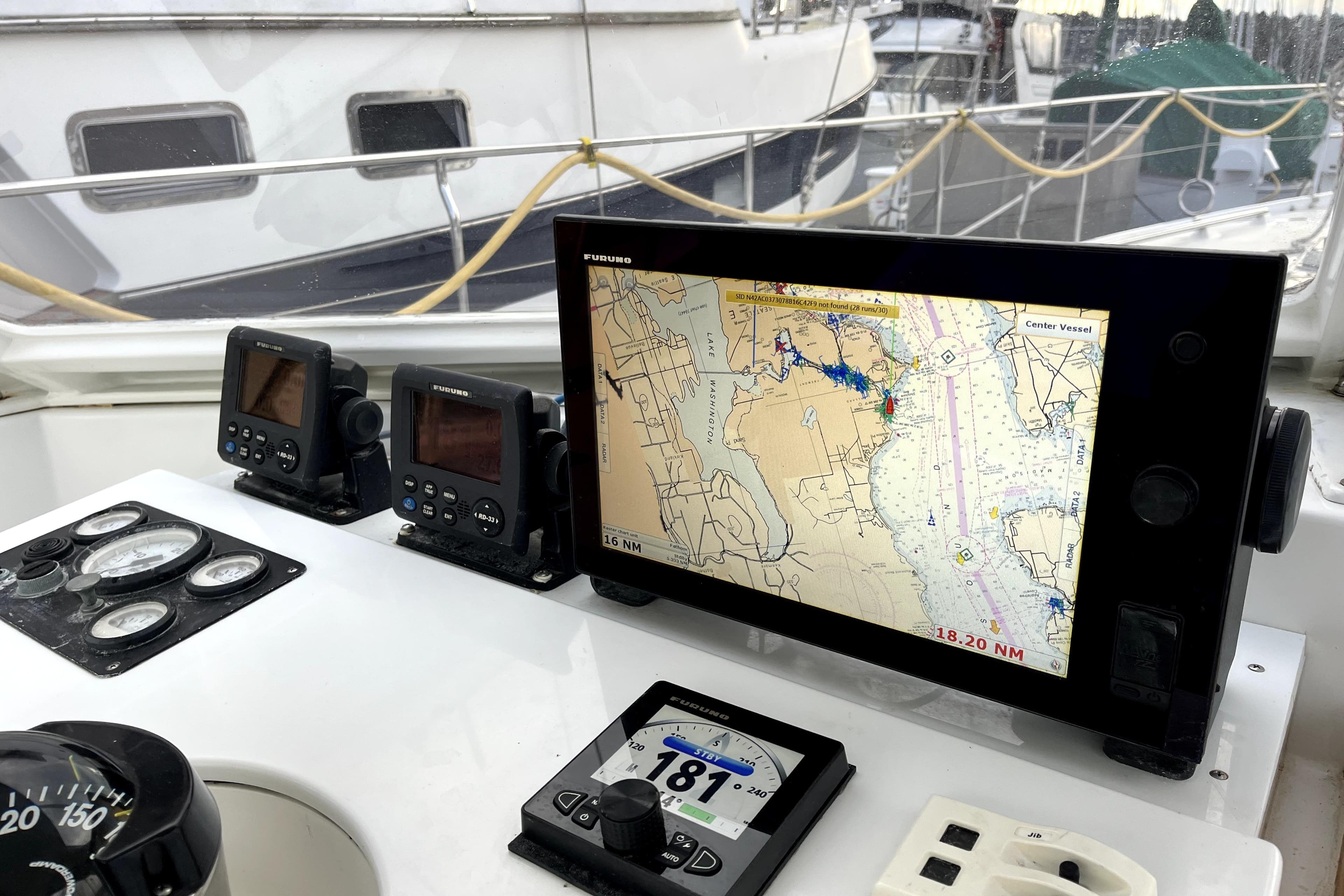 Navigation equipment on a 1979 Amel Mango sailboat, featuring a Furuno chart plotter.