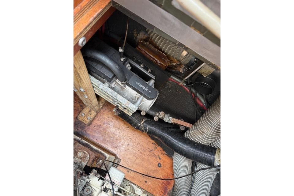 Engine compartment of a 2008 Lagoon 440 catamaran, showing mechanical components and hoses.