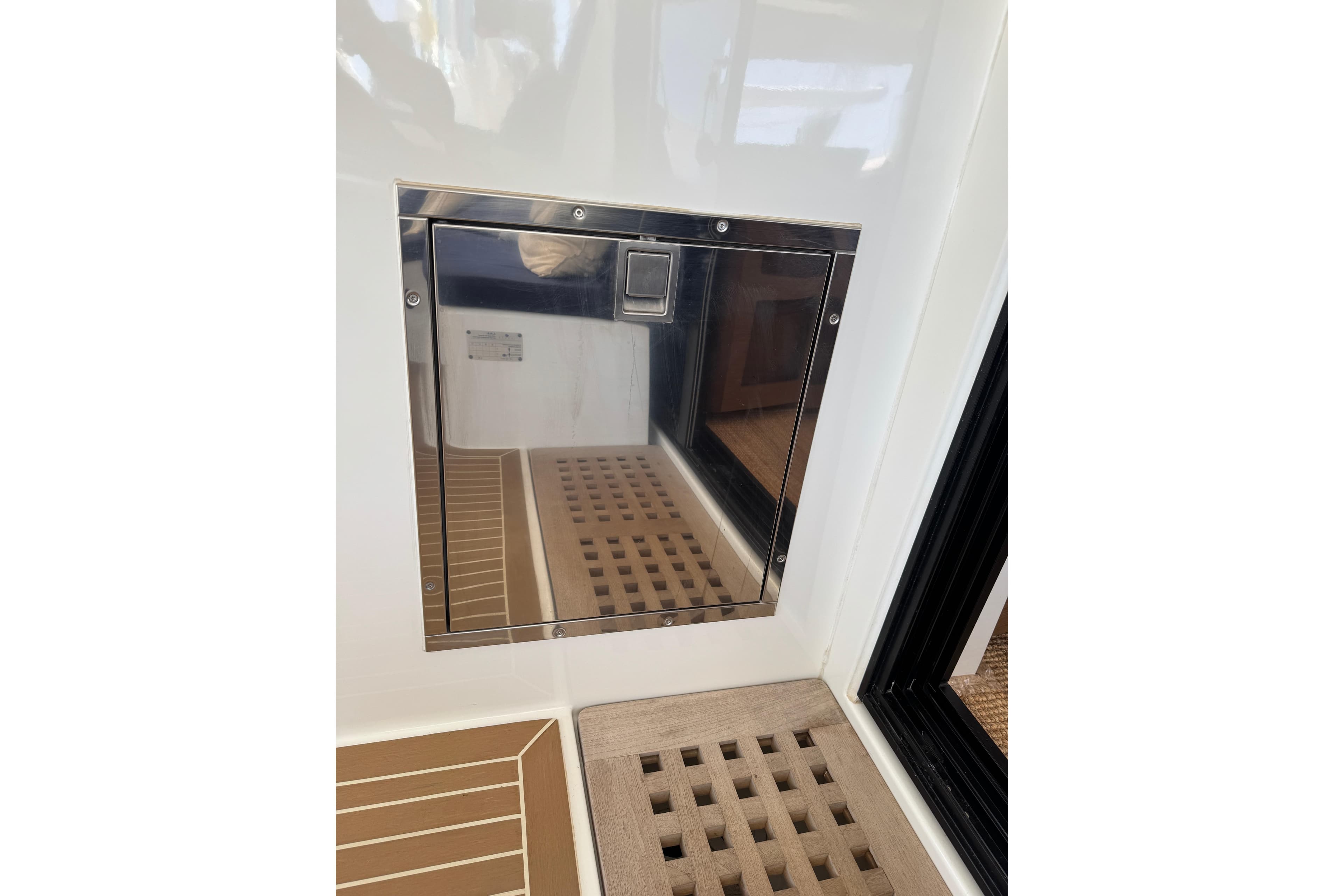 Stainless steel hatch on 2020 Lagoon 42 yacht, featuring teak flooring.