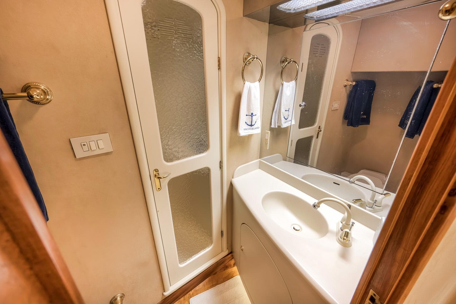 Luxurious bathroom interior of 1999 Hines-Farley SPORTFISHERMAN yacht with elegant fixtures.