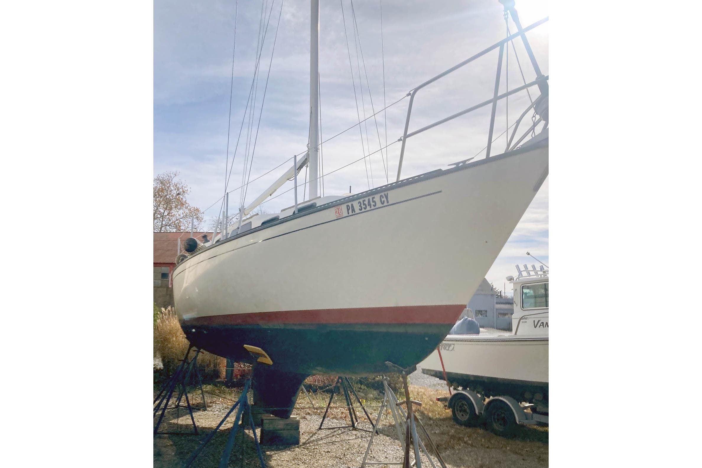 1985 S2 Yachts 9.2 C sailboat on stands, side view.