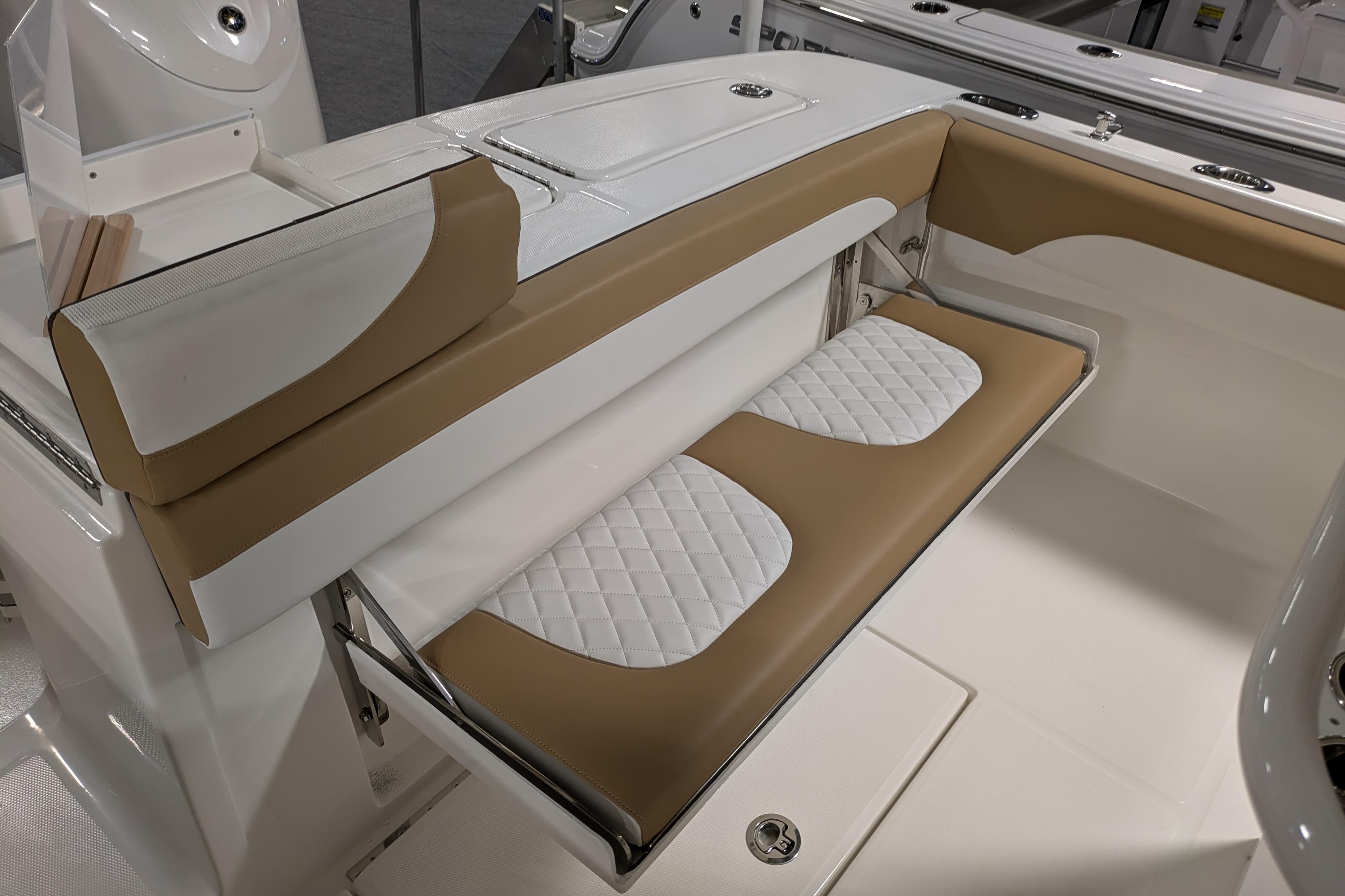 2025 Regulator 25 boat interior with tan and white cushioned seating.