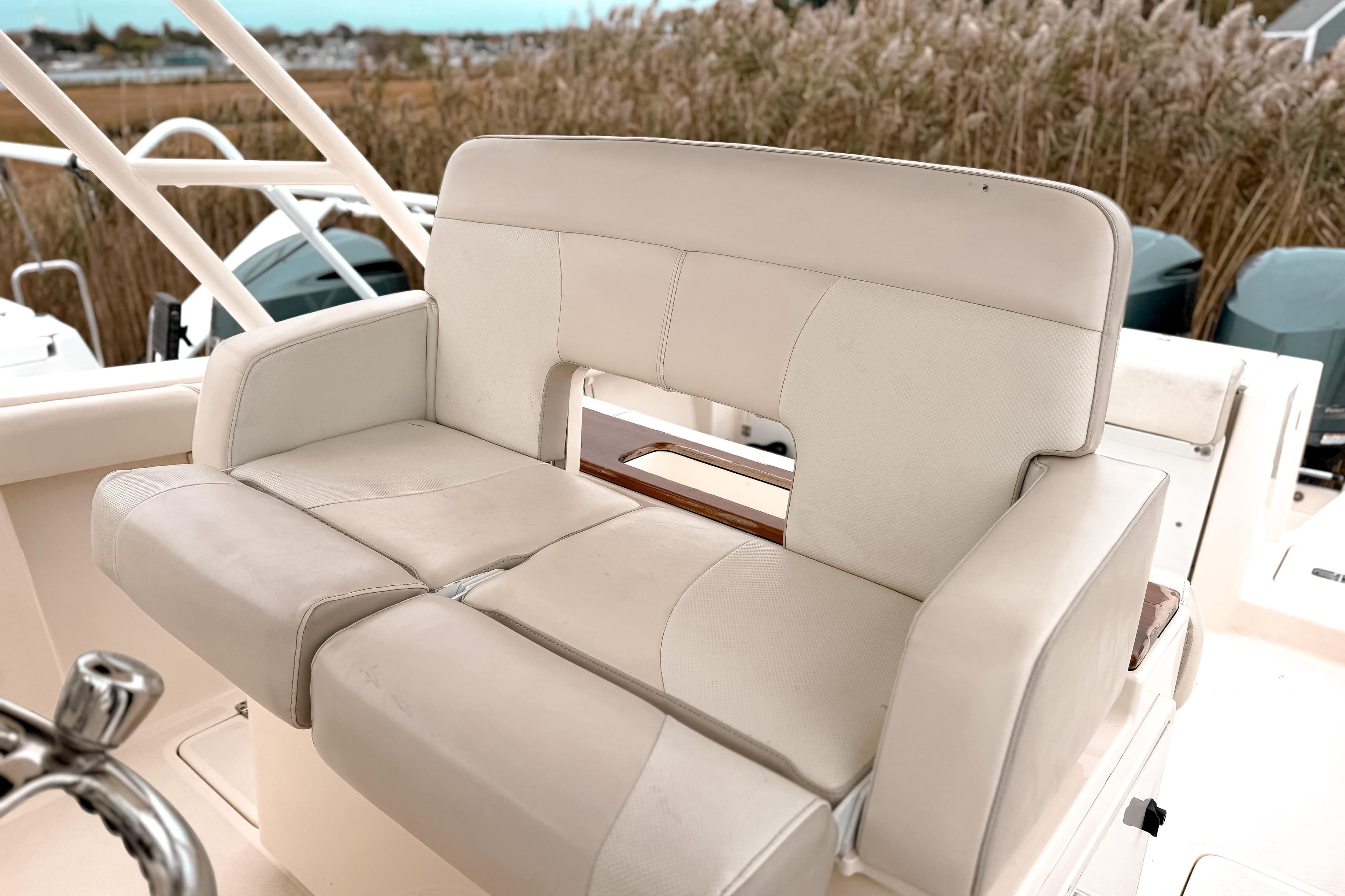 2014 Pursuit S 280 Sport boat seat with beige upholstery and sturdy design.