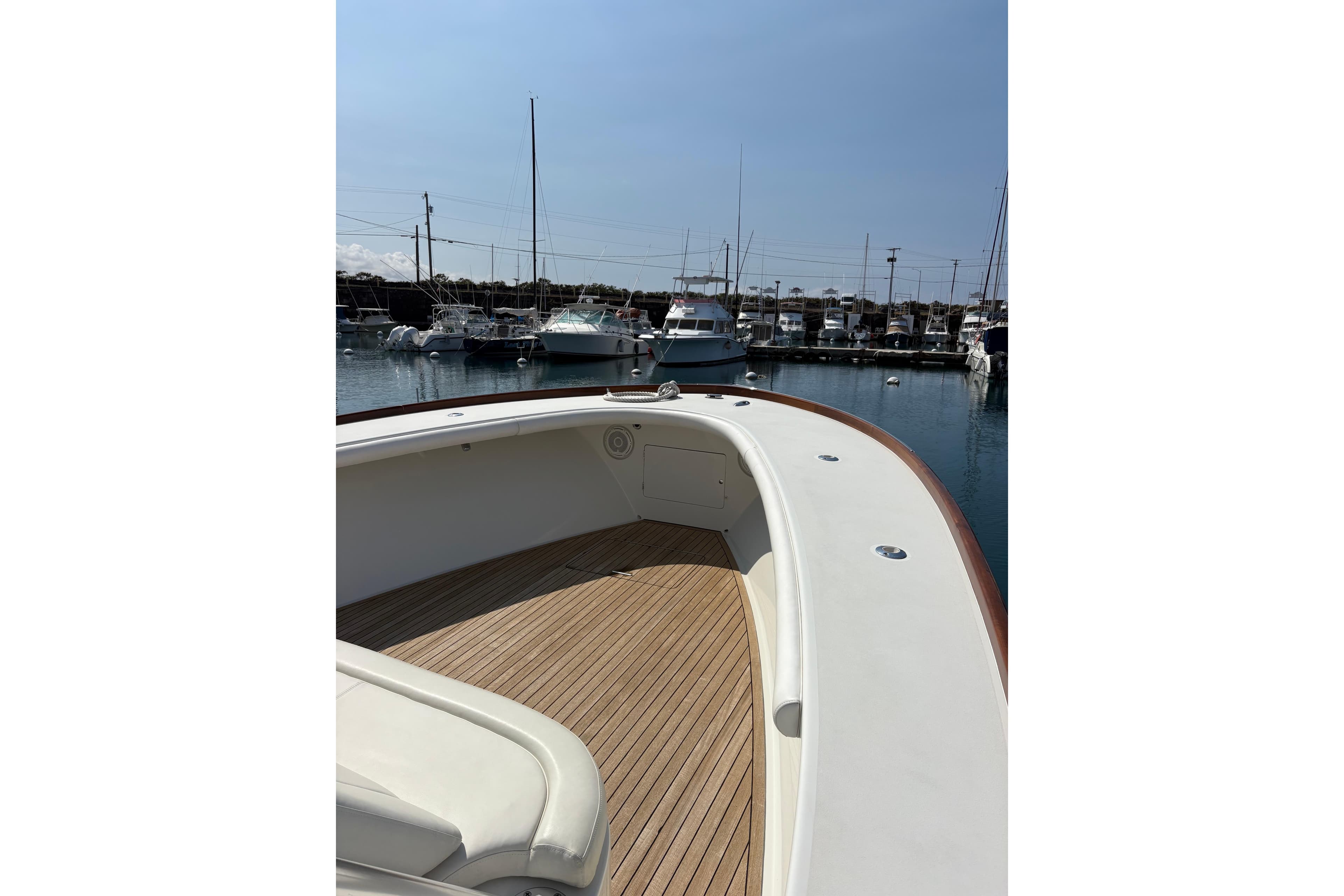 2007 Gamefisherman 42 Walkaround boat docked in marina, featuring spacious deck and sleek design.