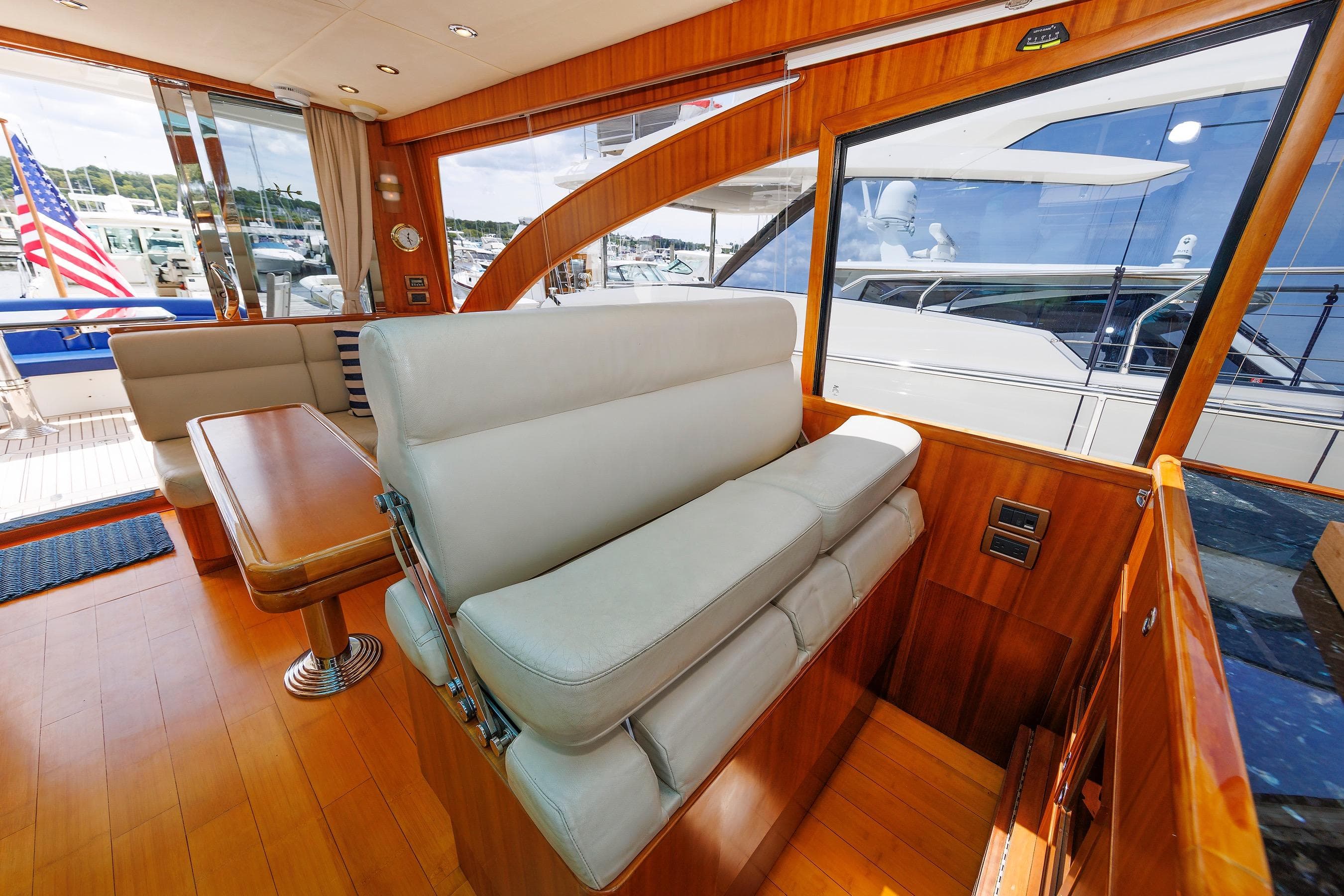 Luxurious interior of 2009 Hunt Yachts 52 Express with elegant seating and wooden finishes.