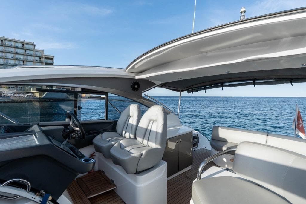 Luxury 2021 Princess V40 yacht interior with ocean view and modern seating.