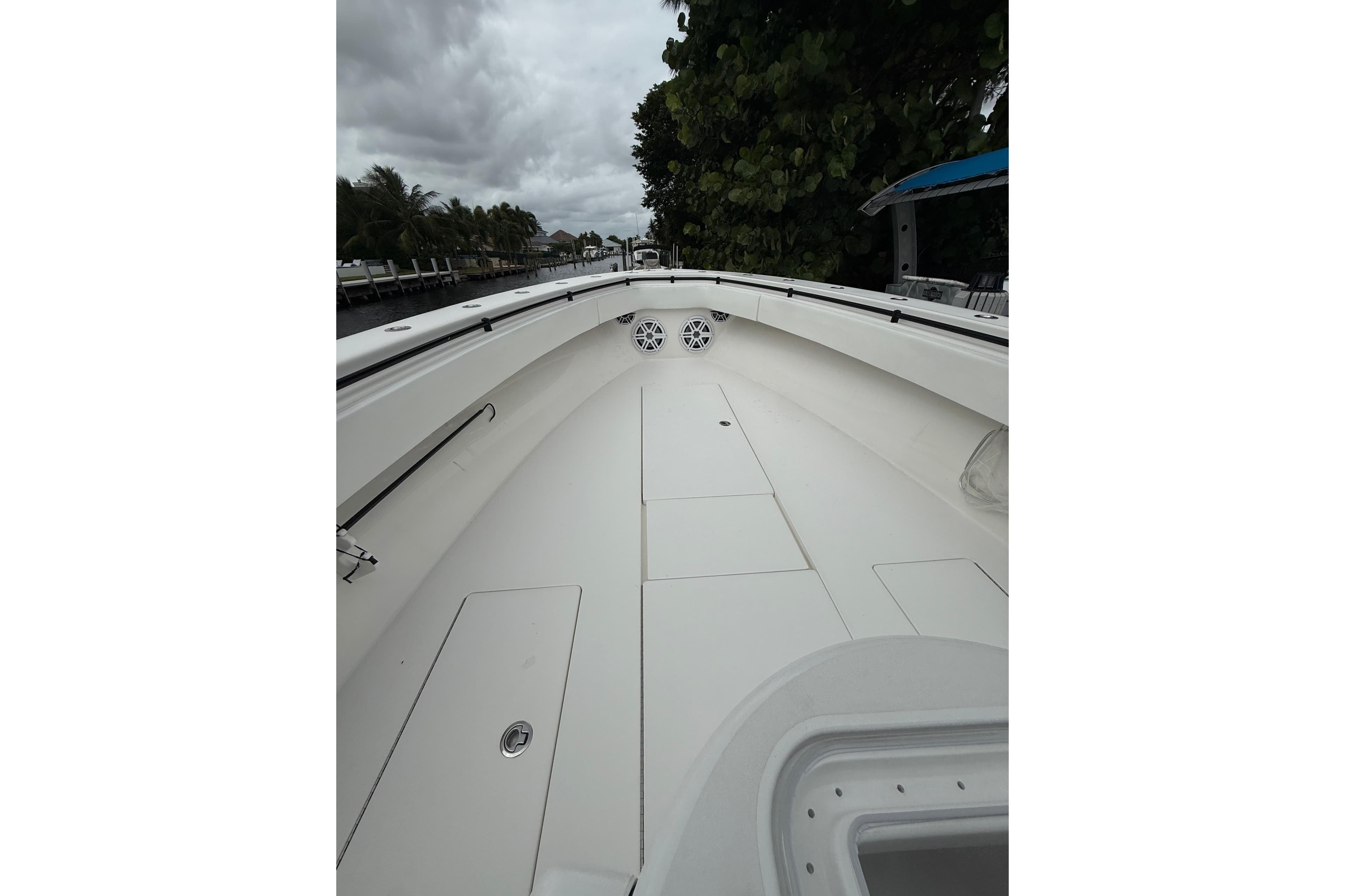 2020 Contender 39 ST boat interior with sleek white deck and storage compartments.