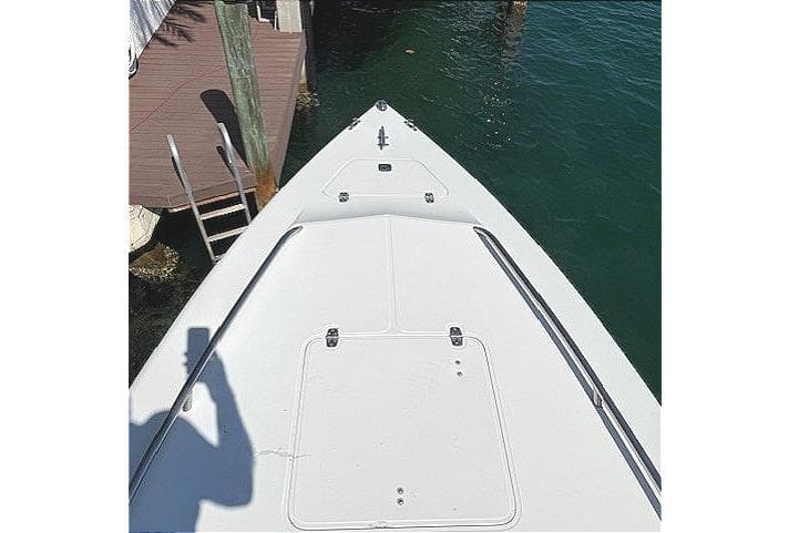 1996 Powerplay Powerboats 33 Sportfish bow view at dockside.