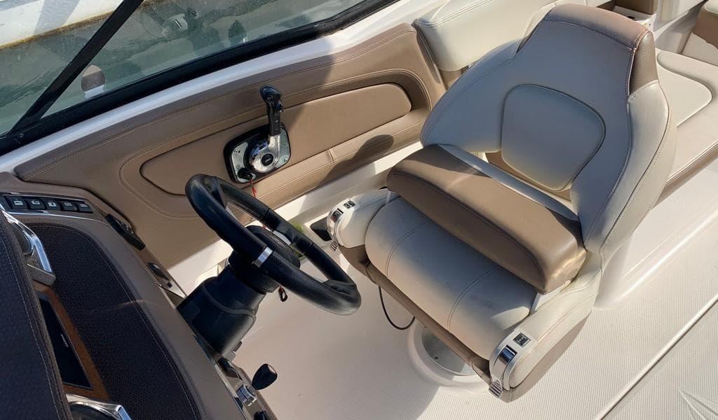 2014 Chaparral 257 SSX boat interior with steering wheel and captain's seat.