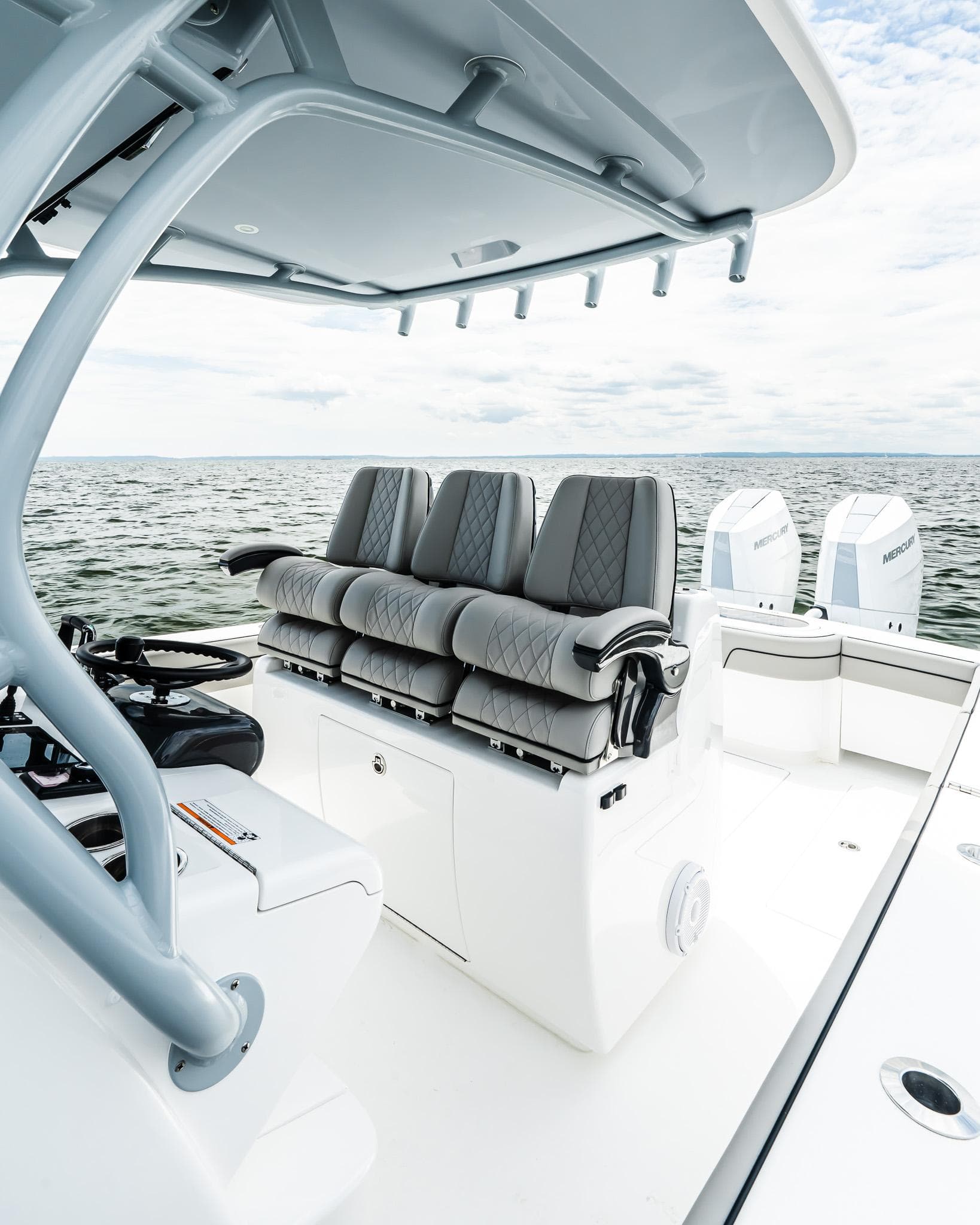 2025 Valhalla Boatworks V-33 with sleek seating and dual engines on open water.