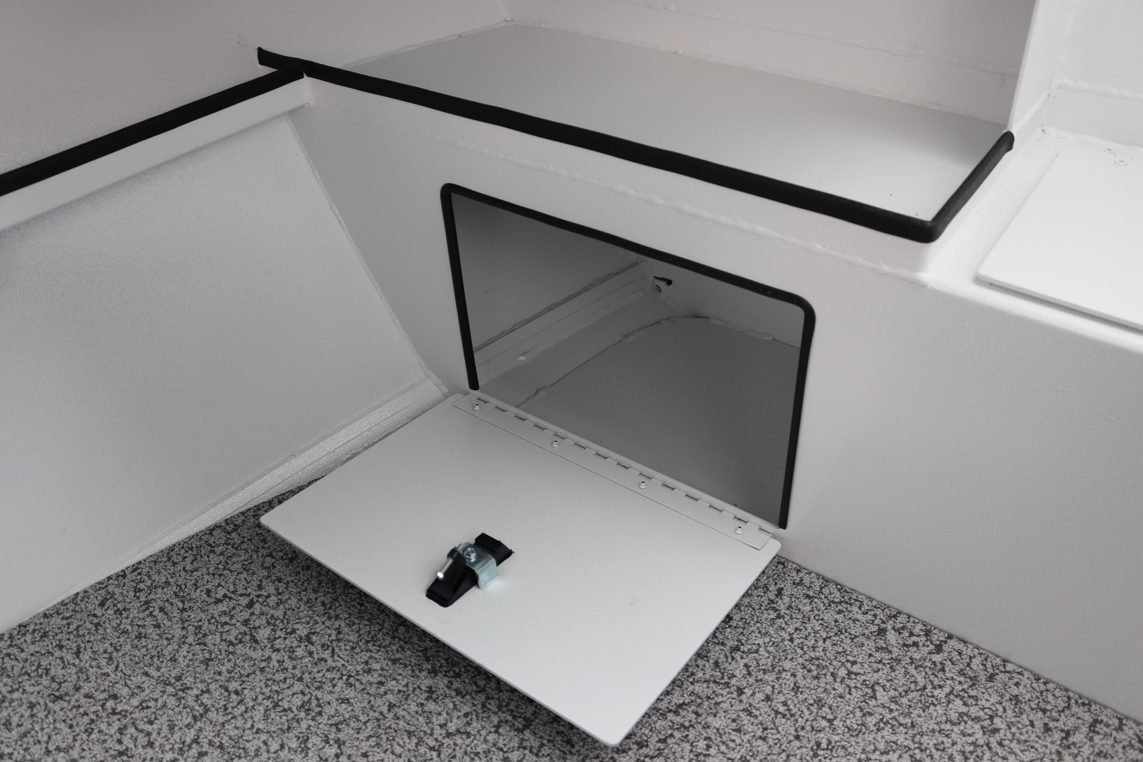 2026 Alumaweld Stryker 202 boat storage compartment with open hatch.