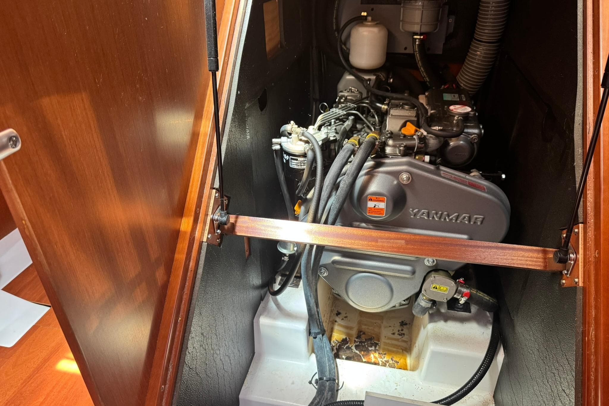 Engine compartment of a 2014 Beneteau Oceanis 45 sailboat, featuring a Yanmar engine.