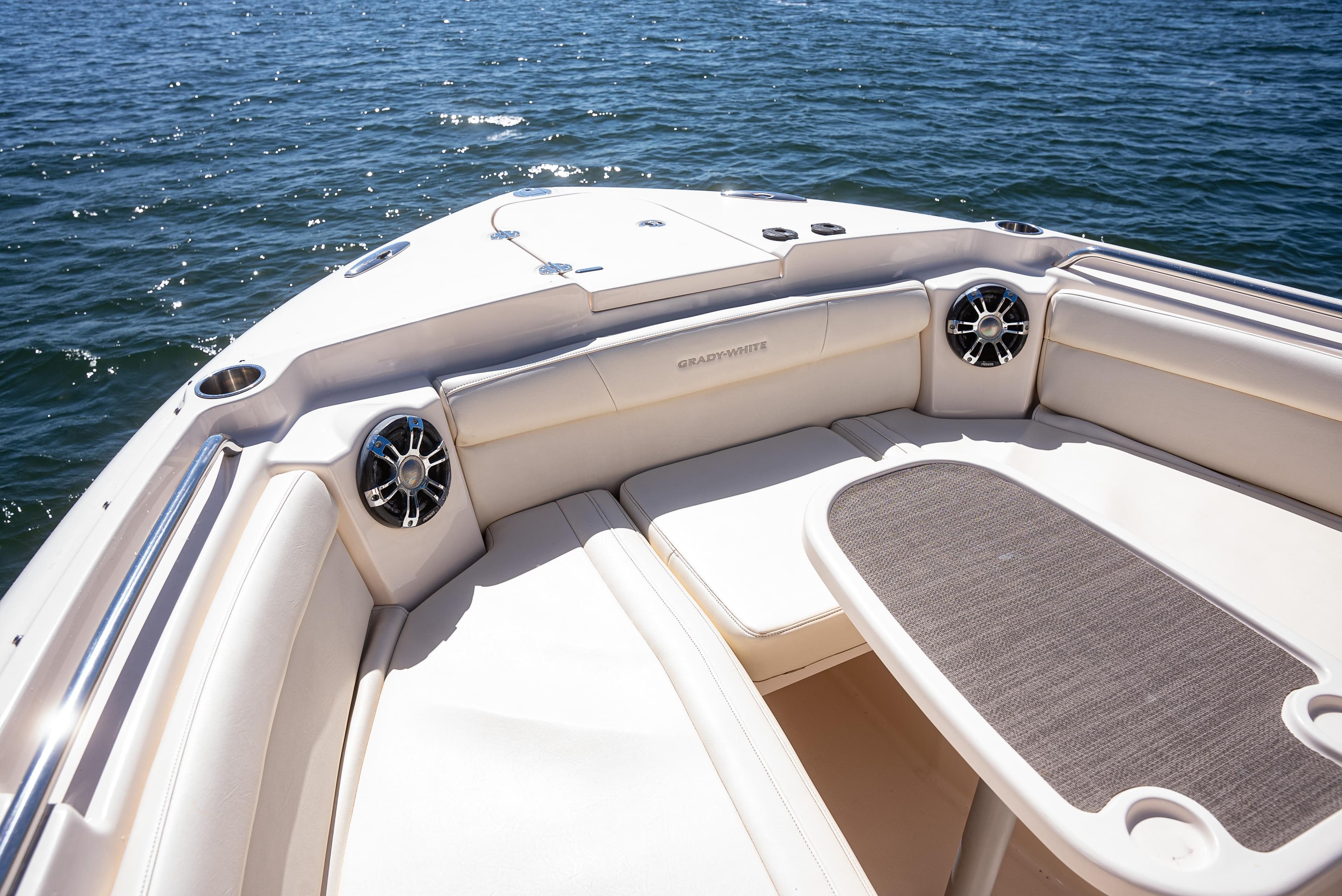 2020 Grady-White Freedom 285 boat interior with seating and table on water.