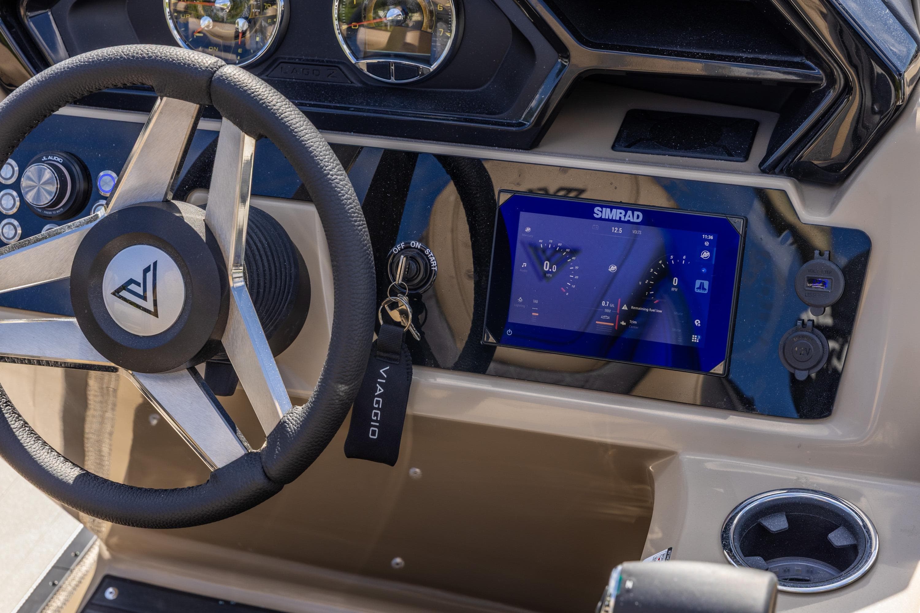 Viaggio Lago Z-S 2026 boat dashboard with steering wheel and Simrad display.