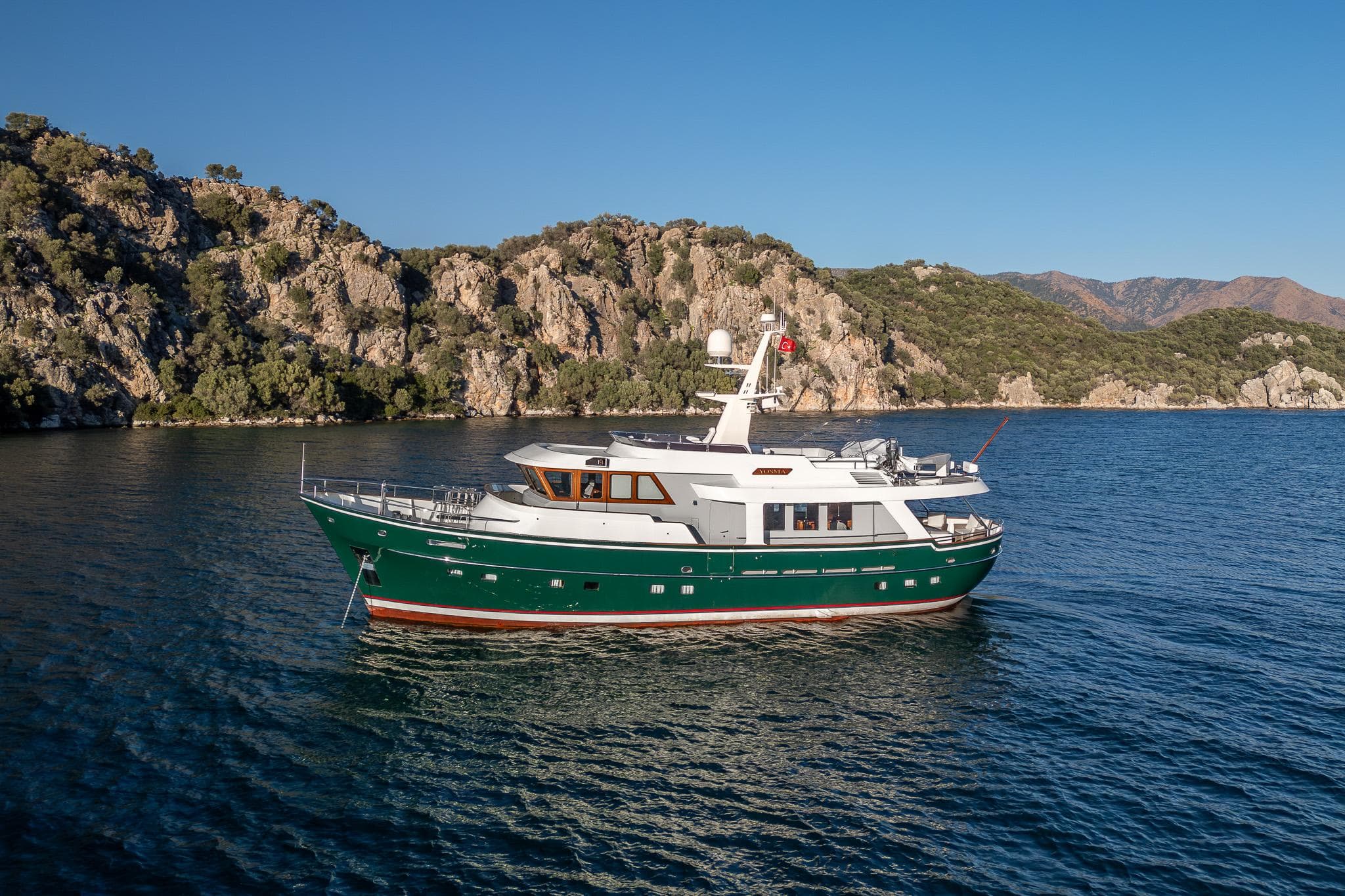 Luxurious 2013 Motor Yacht 71' cruising in scenic coastal waters.