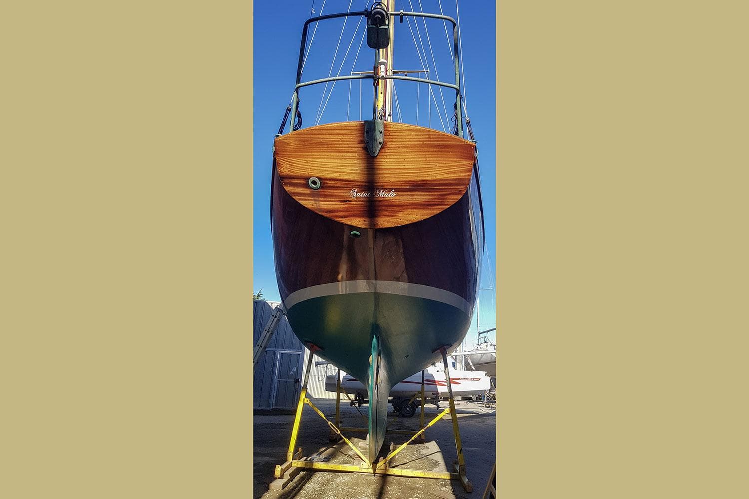 1963 Sparkman & Stephens Finesterre sailboat on dry dock, viewed from stern.