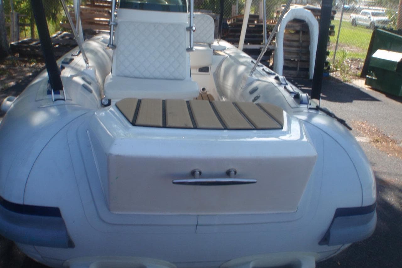 2023 Tiger Marine 440SL inflatable boat, rear view, featuring white seating and deck.