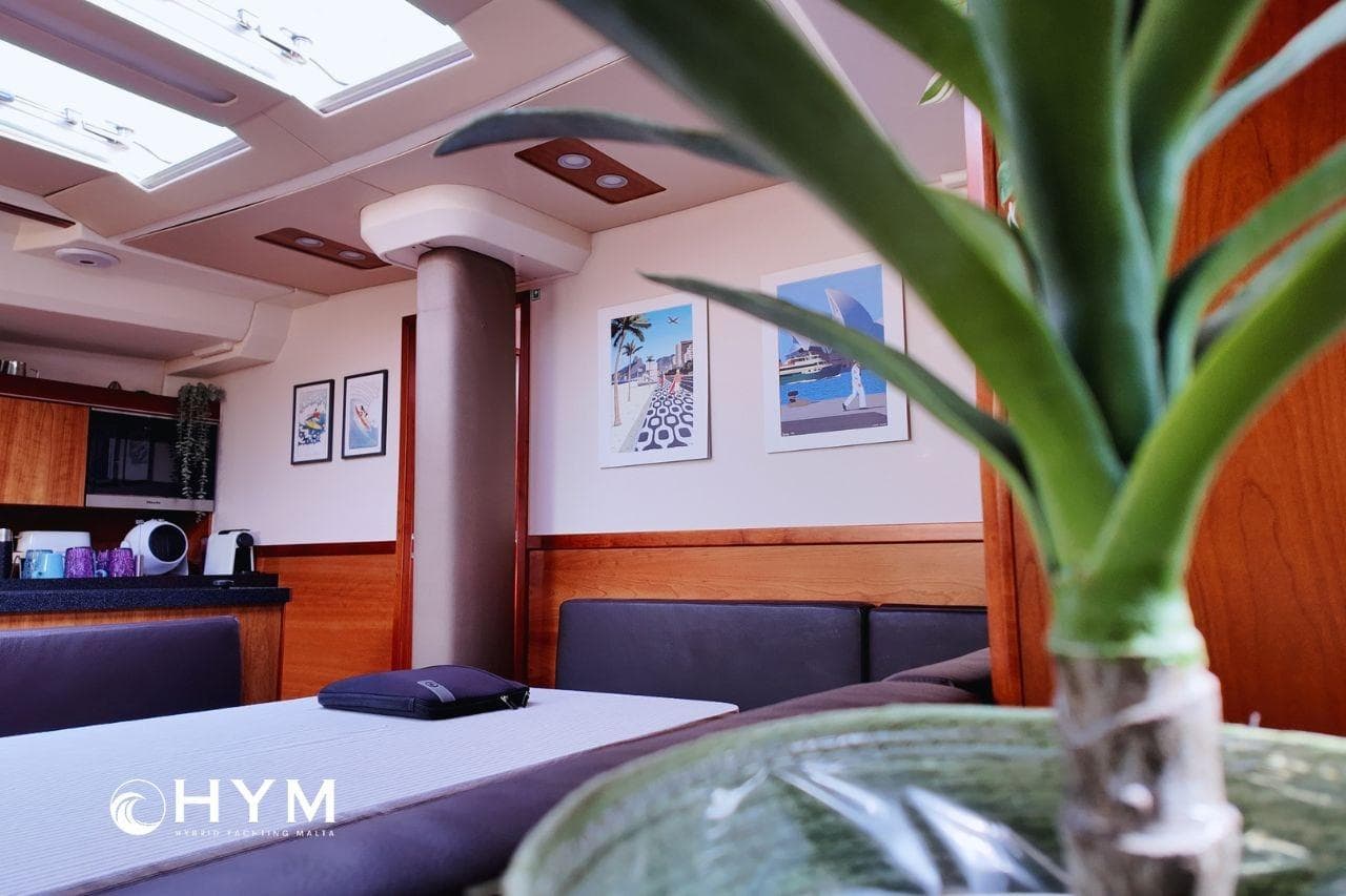 Luxurious interior of 2014 Hanse 575 yacht with modern decor and natural light.