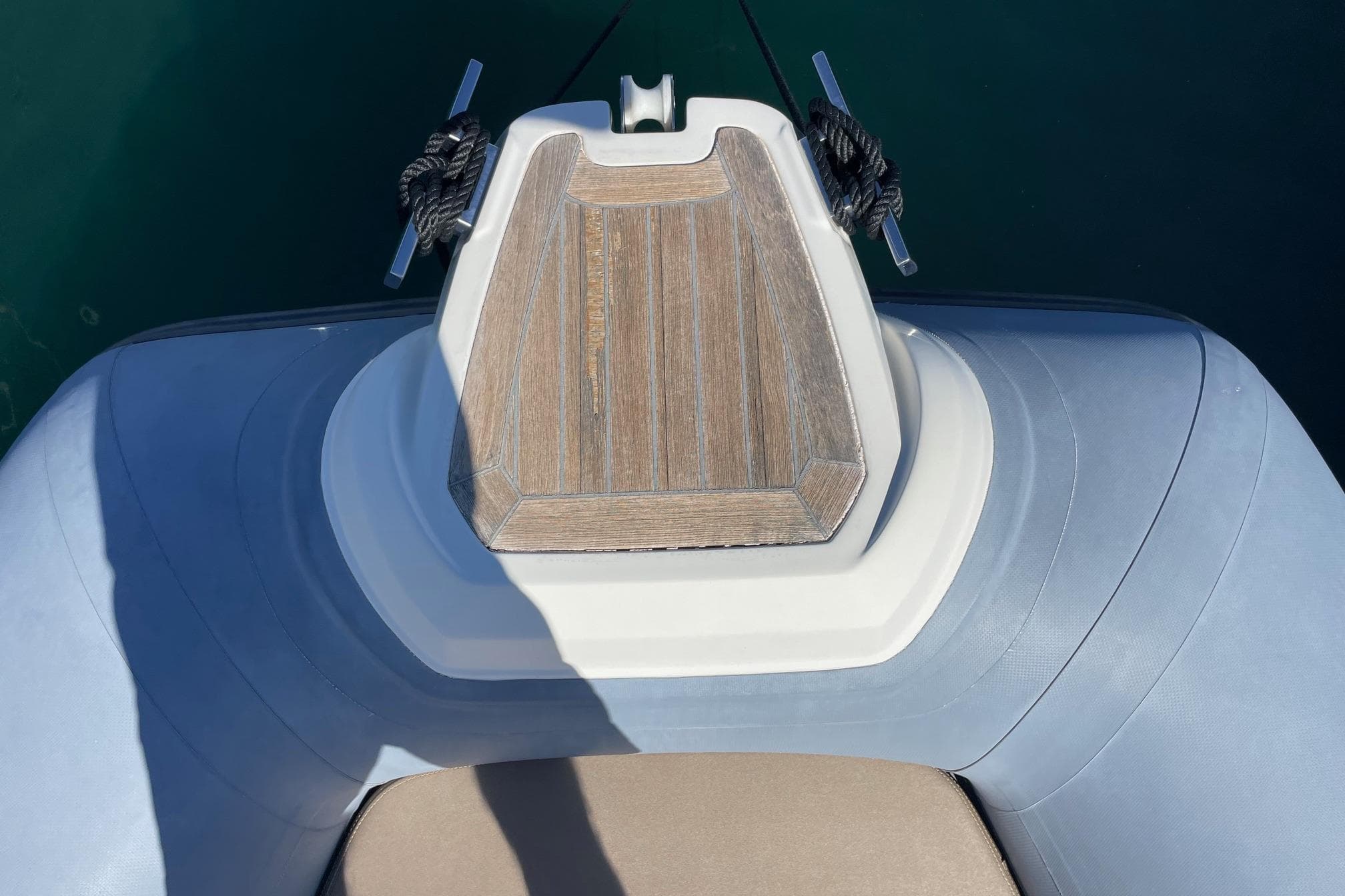 Top view of 2018 Joker Boat CLUBMAN 28's bow with wooden deck detail.