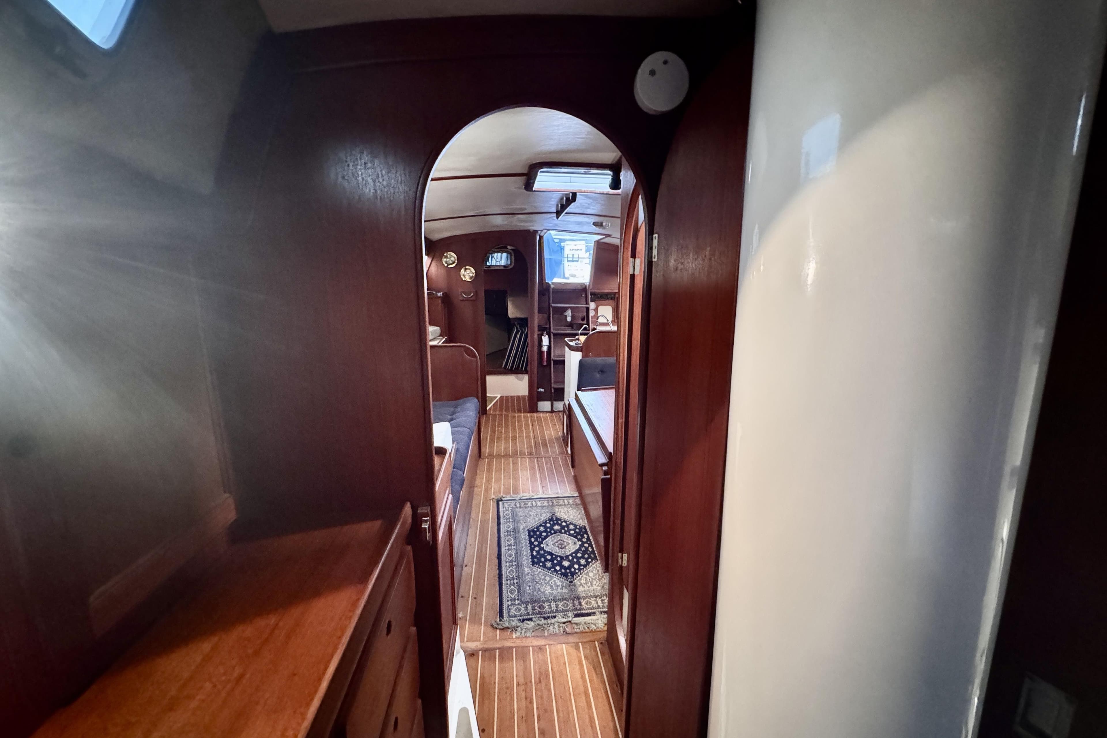 Interior of 1991 Freedom 38 sailboat with wooden finishes and cozy cabin layout.