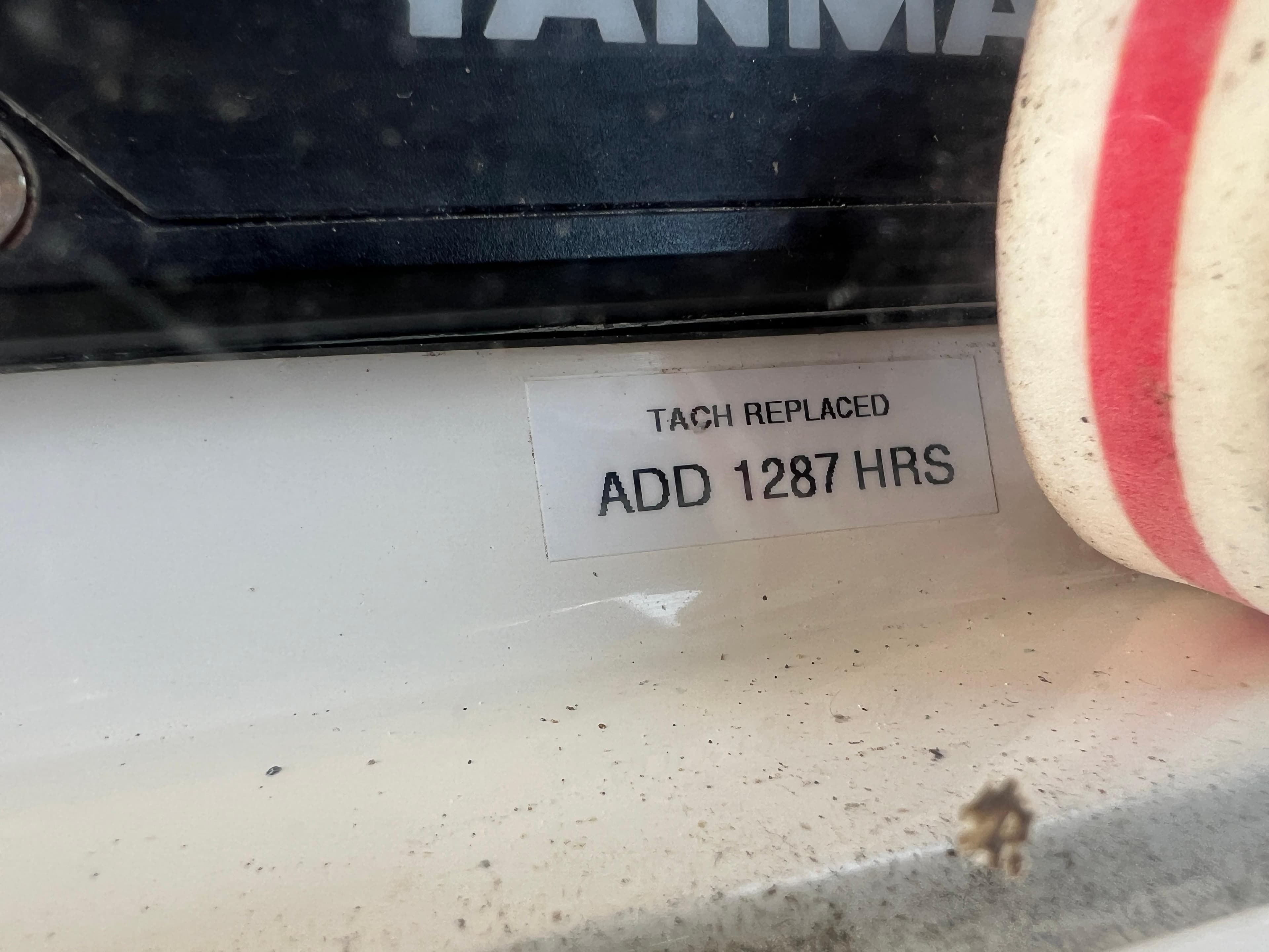 Sticker reads "Tach replaced, add 1287 hours" on Caliber 40LRC SE 2005.