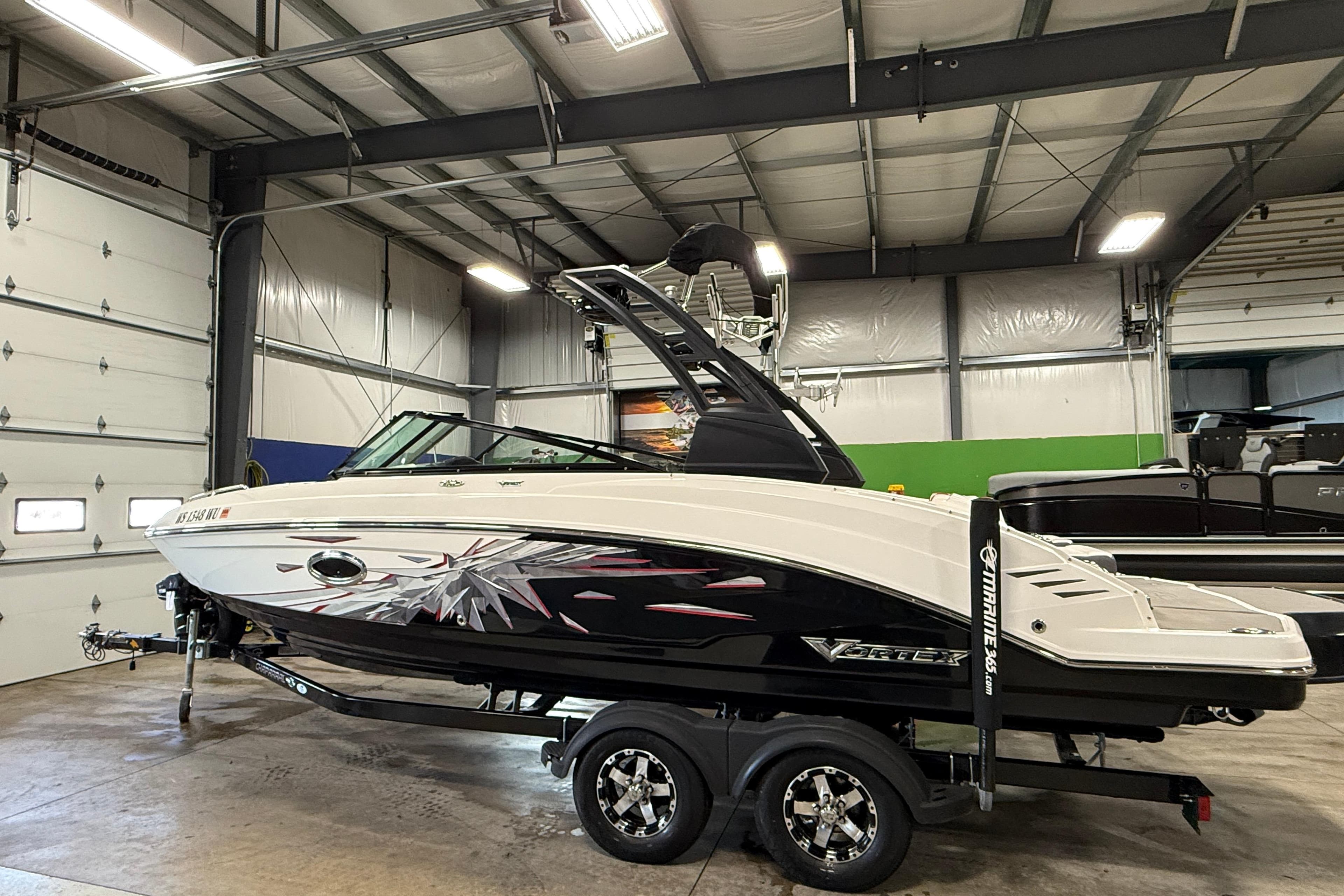 2019 Chaparral Vortex 2430 VRX Wake Series boat in indoor storage facility.