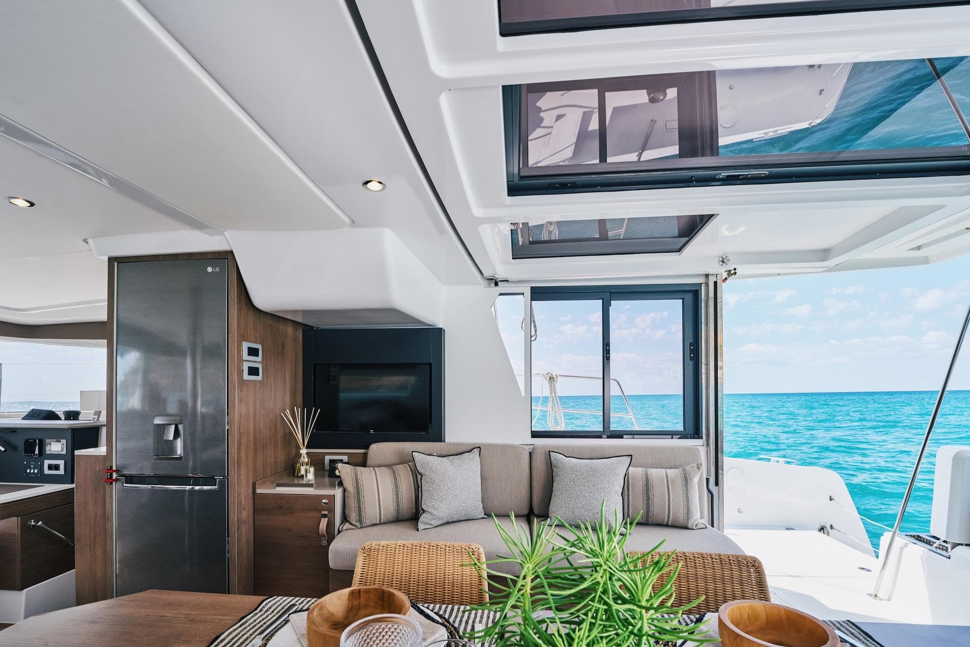 Luxurious interior of 2023 Bali 4.2 OPEN SPACE yacht with ocean view.