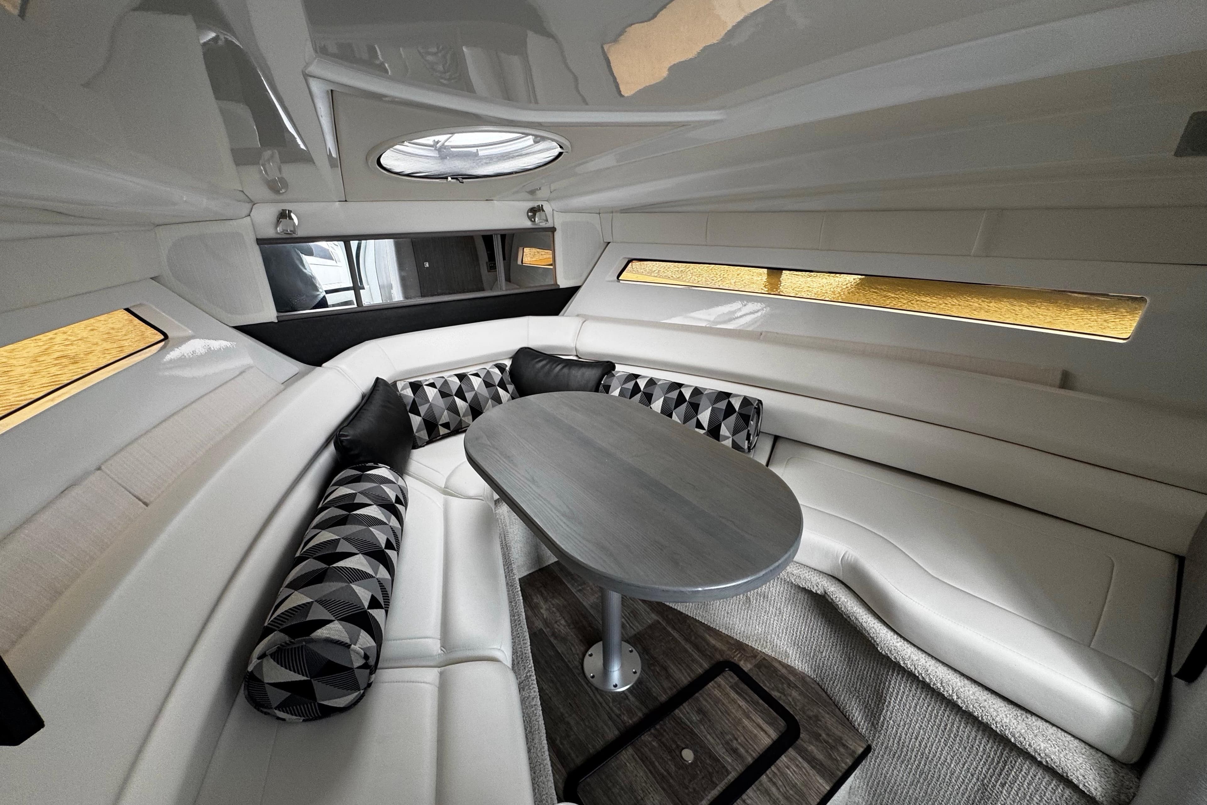 Interior of 2022 Monterey 295 Sport Yacht with elegant seating and modern design.