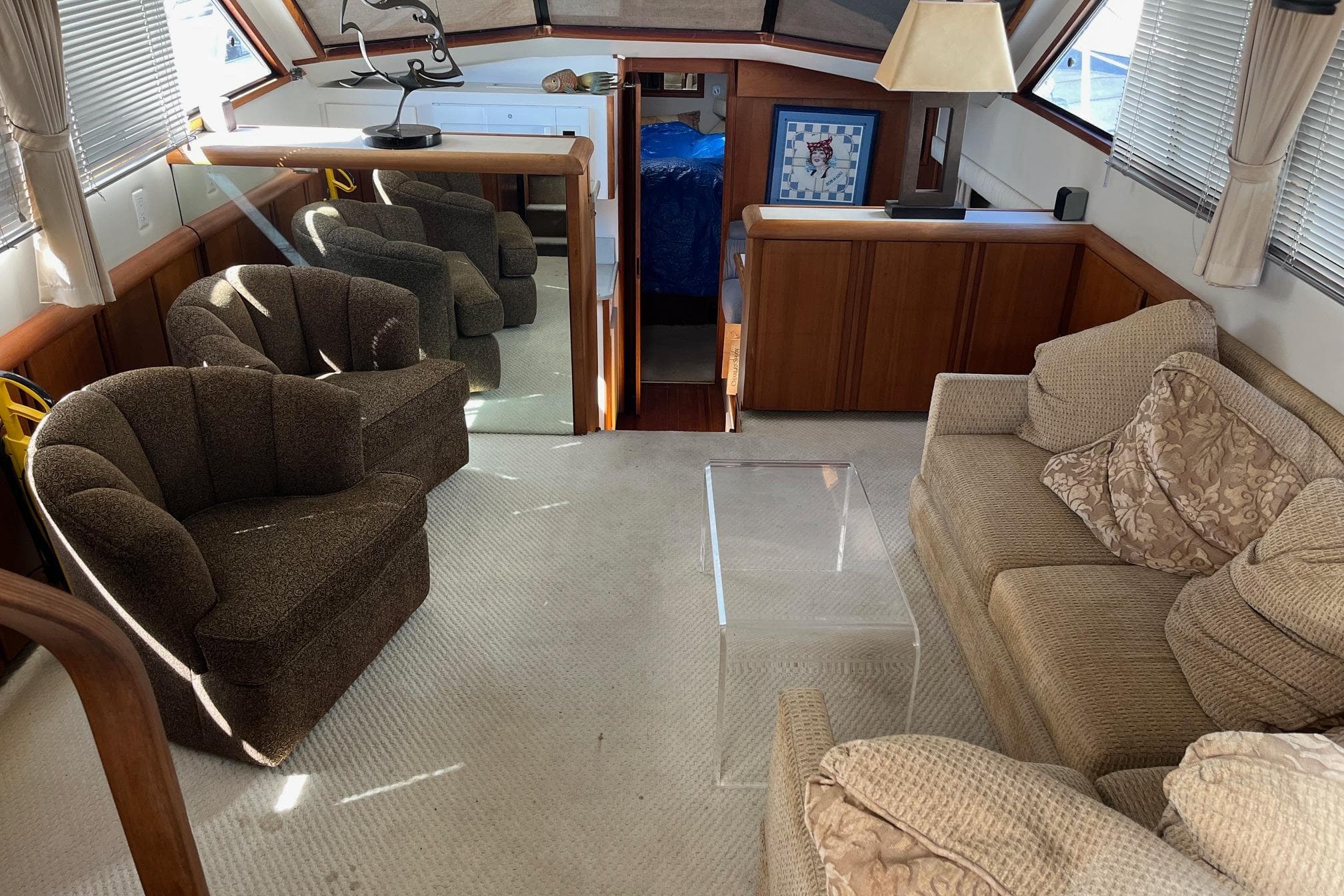 Luxurious interior of a 1990 Californian 52 Cockpit Motor Yacht with plush seating and elegant decor.