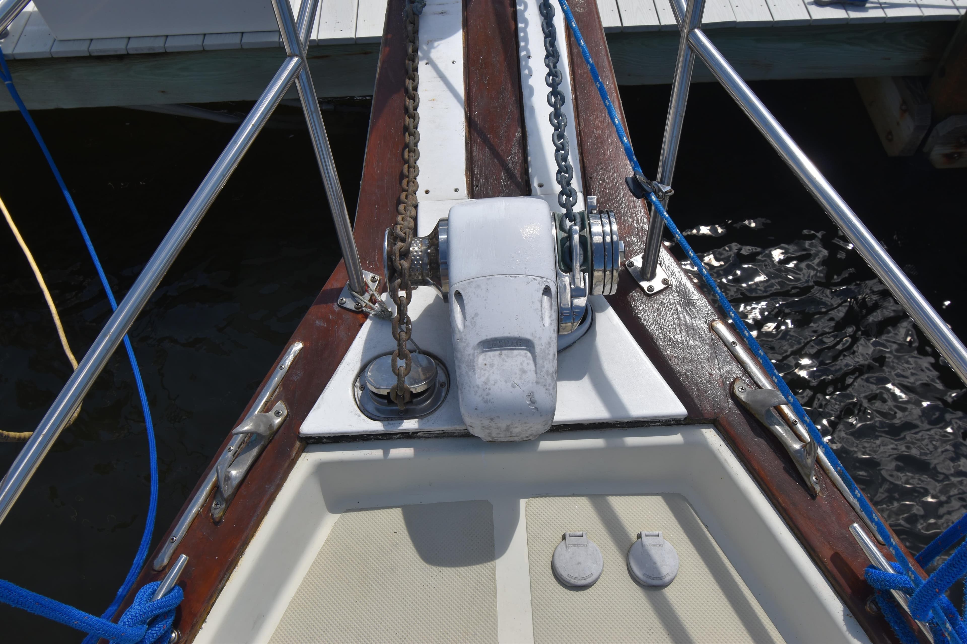 Bow of 1995 Island Packet 37 sailboat with anchor chain and winch.