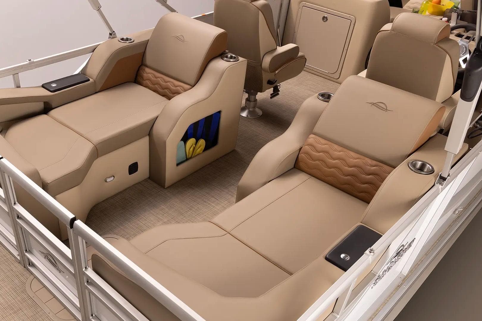 Luxurious interior of 2026 SunCatcher Elite 322SR pontoon boat with plush seating and cup holders.